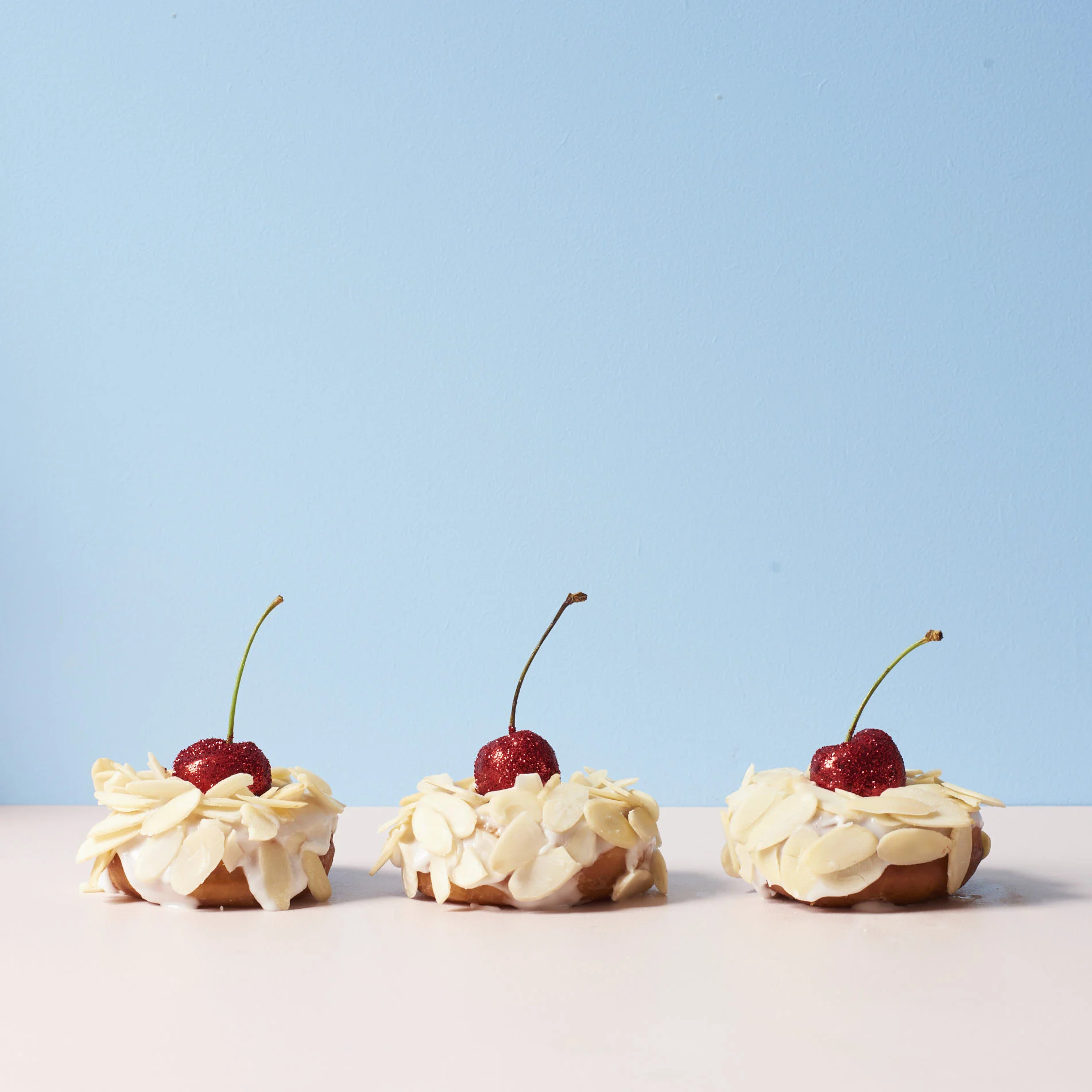 Bakewell Tart: Raspberry jam, almond icing, flaked almonds with a cherry on top