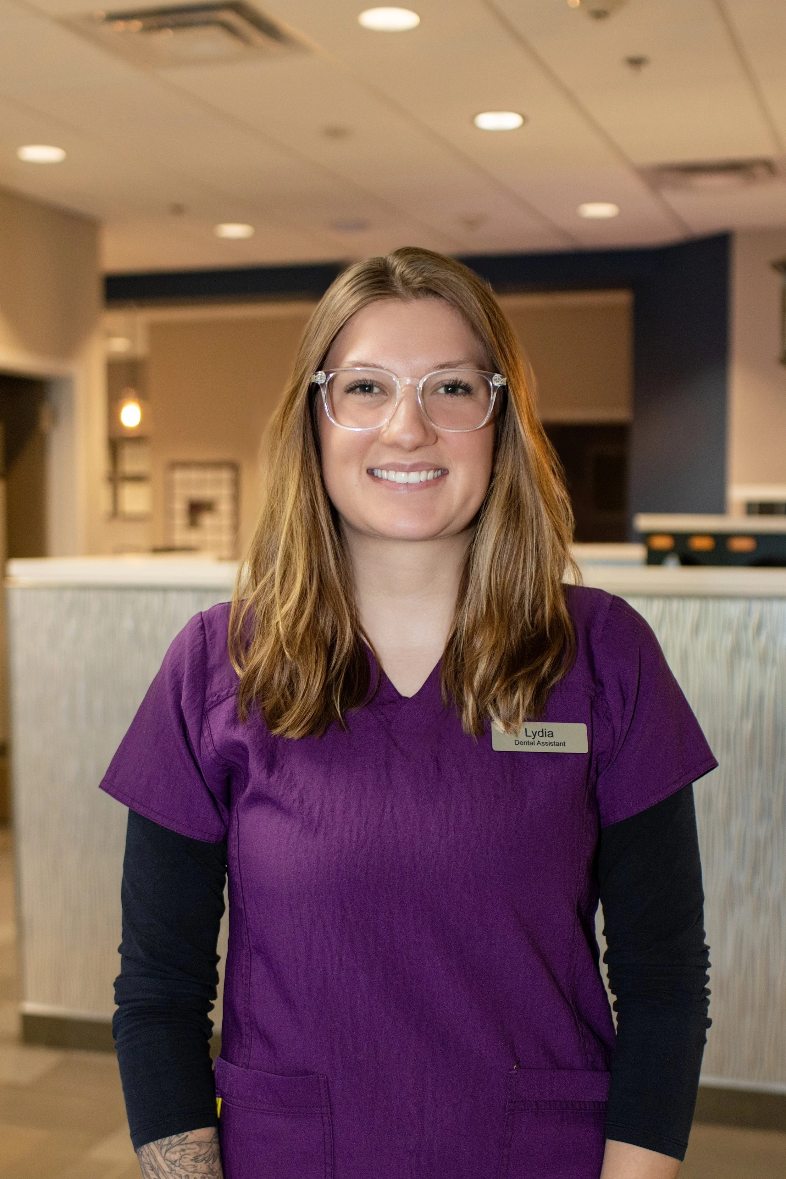 Photo of Lydia wearing glasses