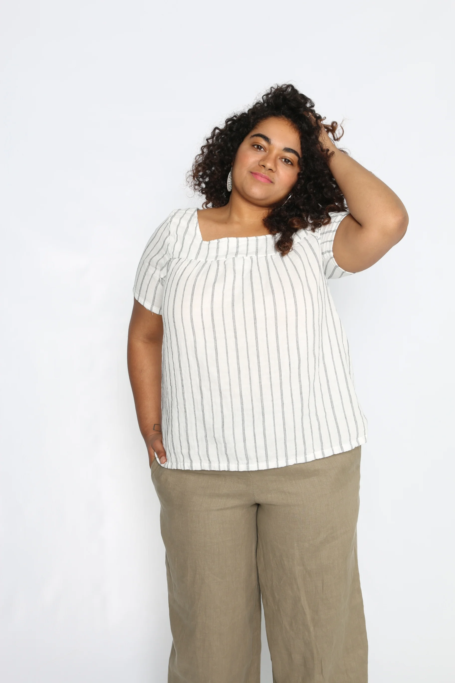 Faith is size Large wearing White Stripe Gauze.