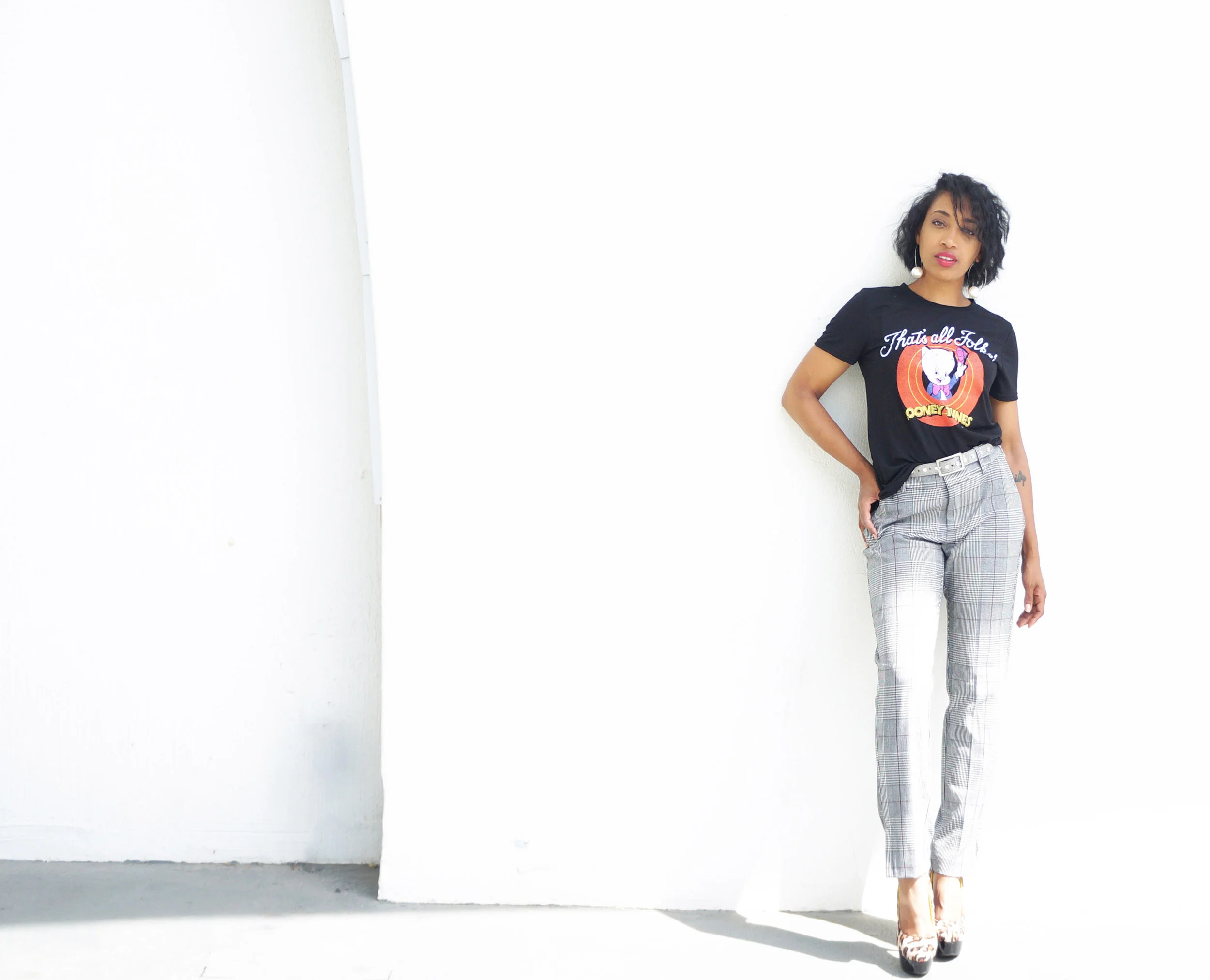 Andrea Fenise Memphis Fashion Blogger styles a graphic tee and windowpane trousers 