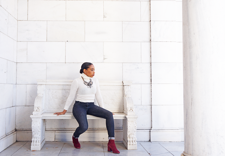 Andrea Fenise Memphis Fashion Blogger styles a white turtleneck and statement necklace