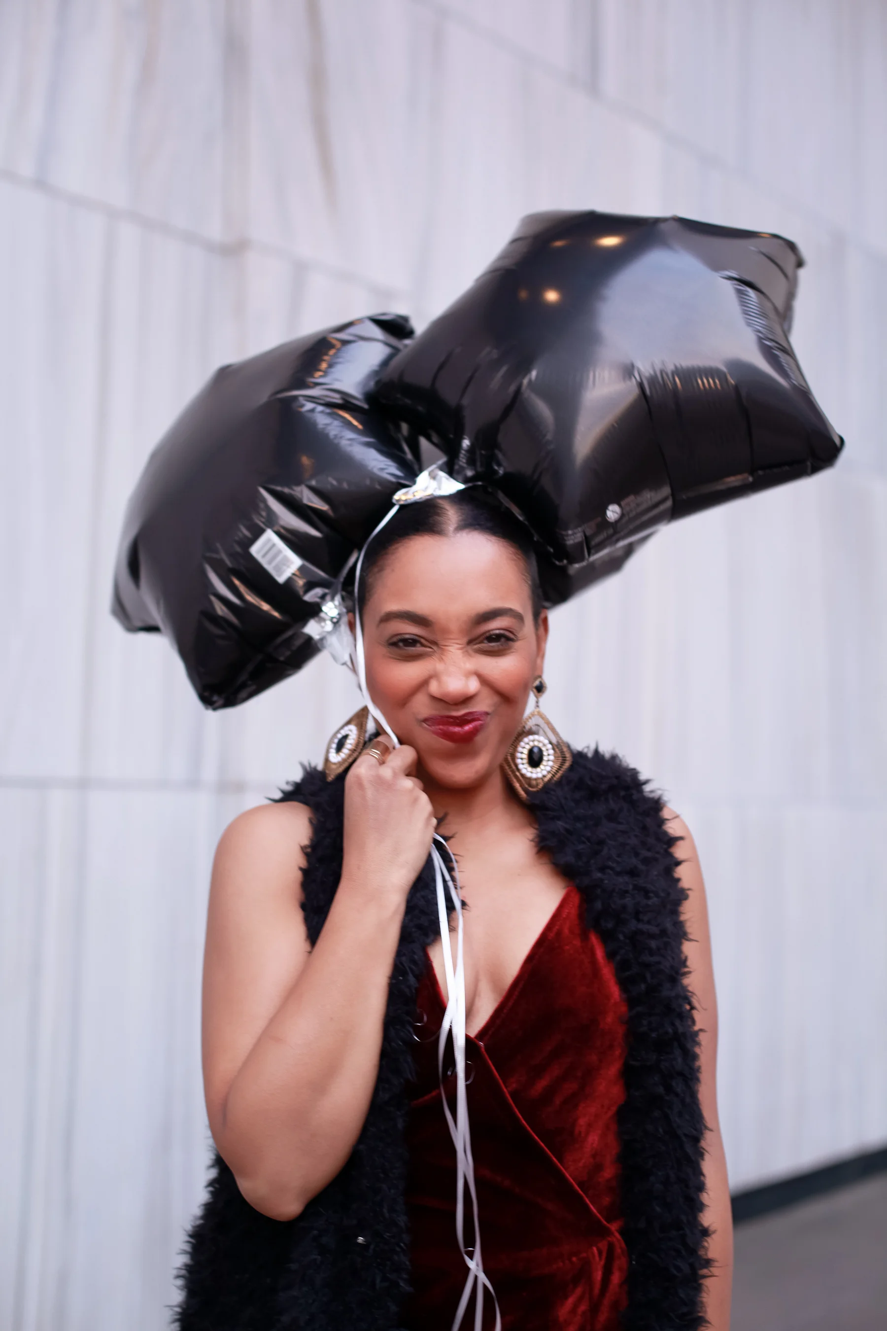 Andrea Fenise Memphis Fashion Blogger shares an outfit inspiration wearing a faux fur vest and velvet romper