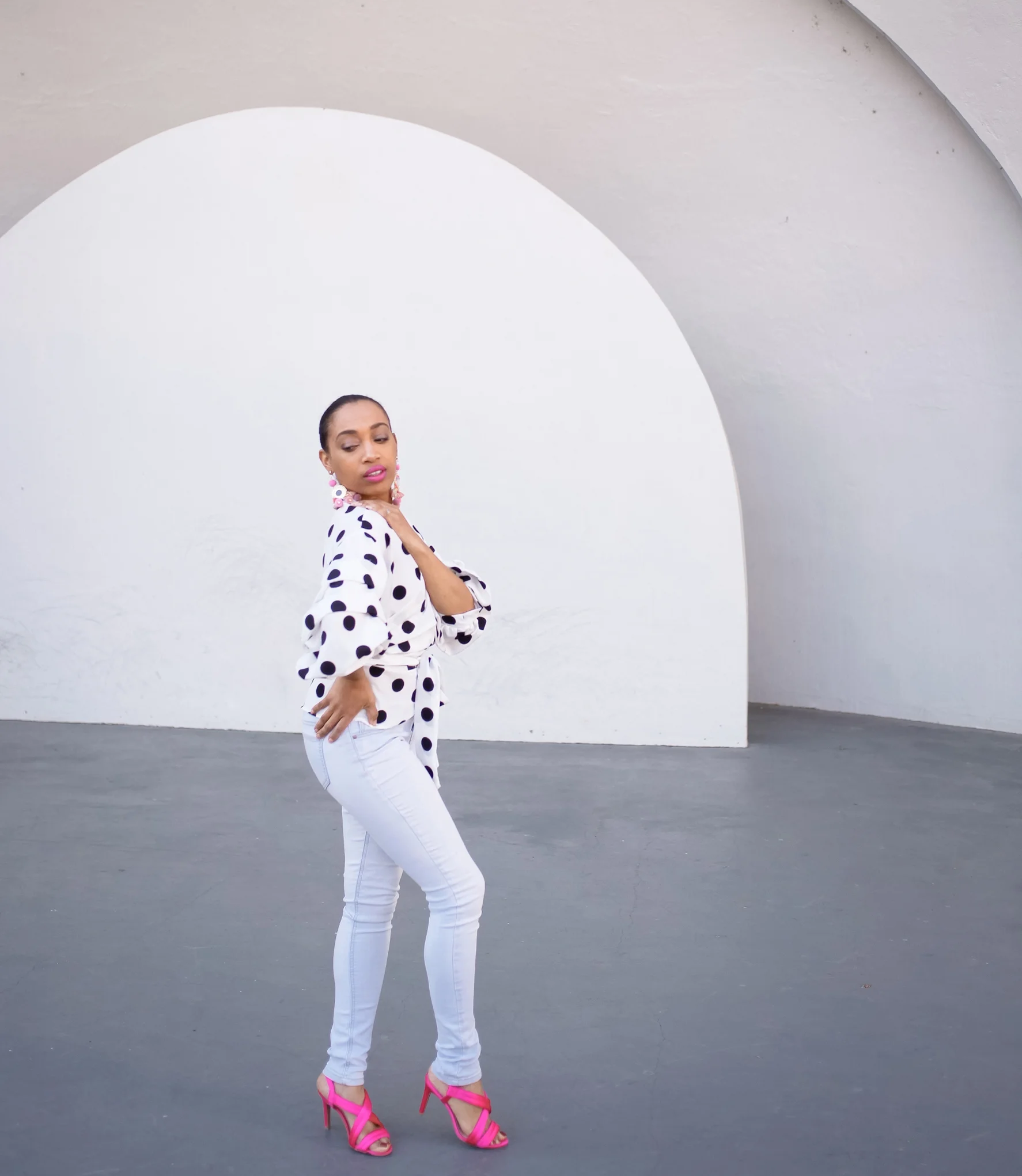 Andrea Fenise Memphis Fashion Blogger shares outfit post with polka dots and pink accessories