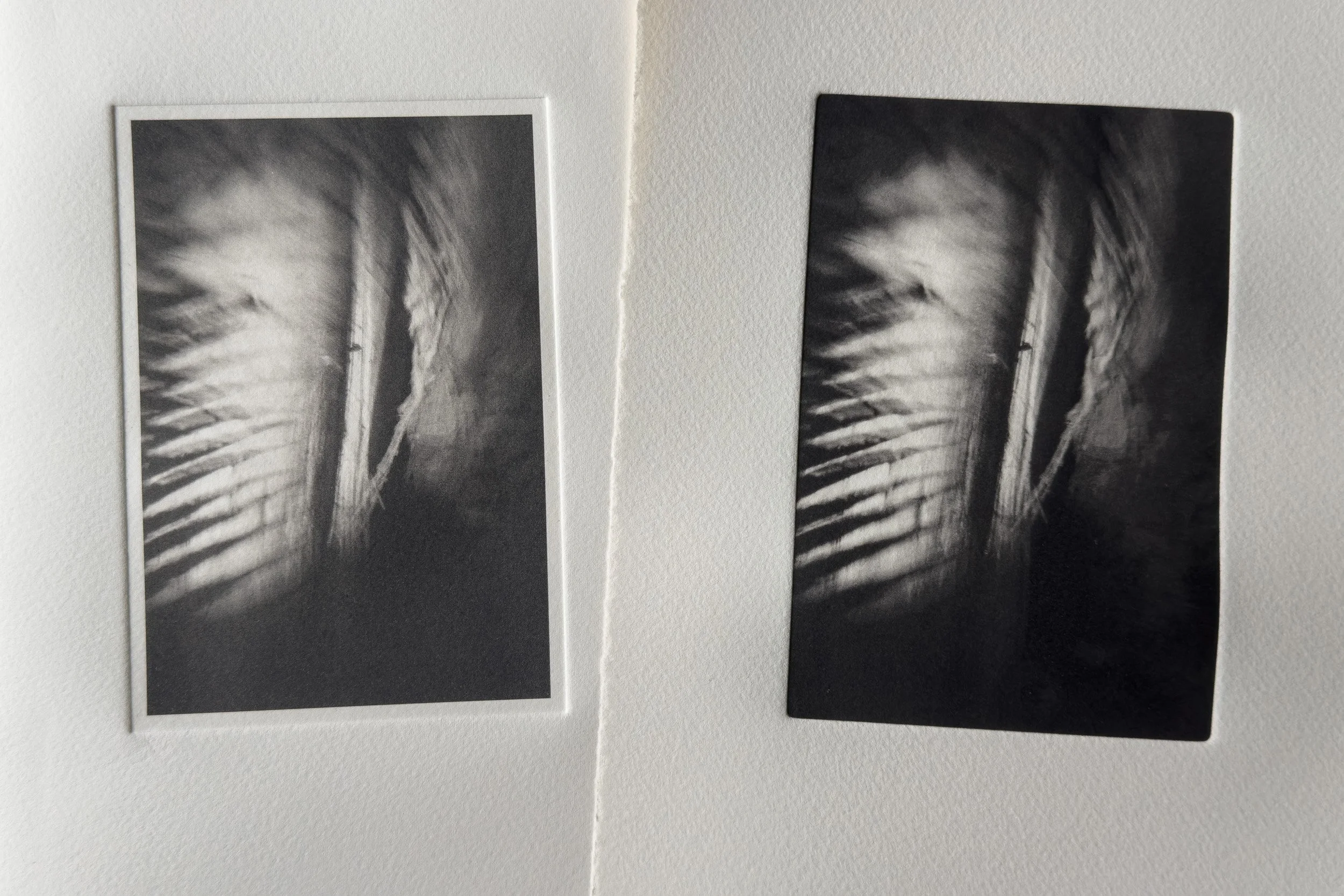 Photograph of two photogravure prints shown side by side, illustrating tonal and border variation.