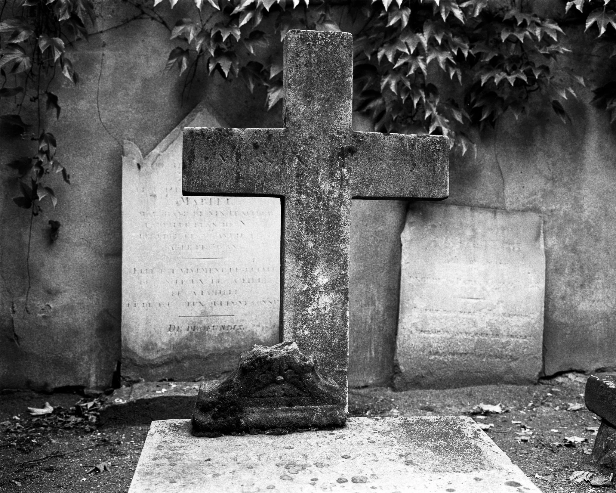 Black-and-white photograph of a tombstone, Paris.
