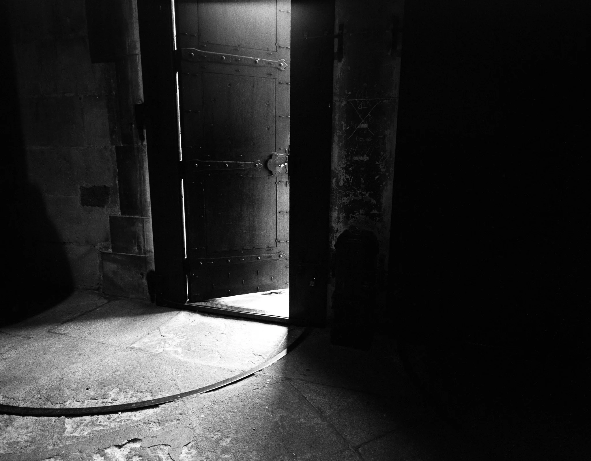Black-and-white photograph of a church door, Lausanne.
