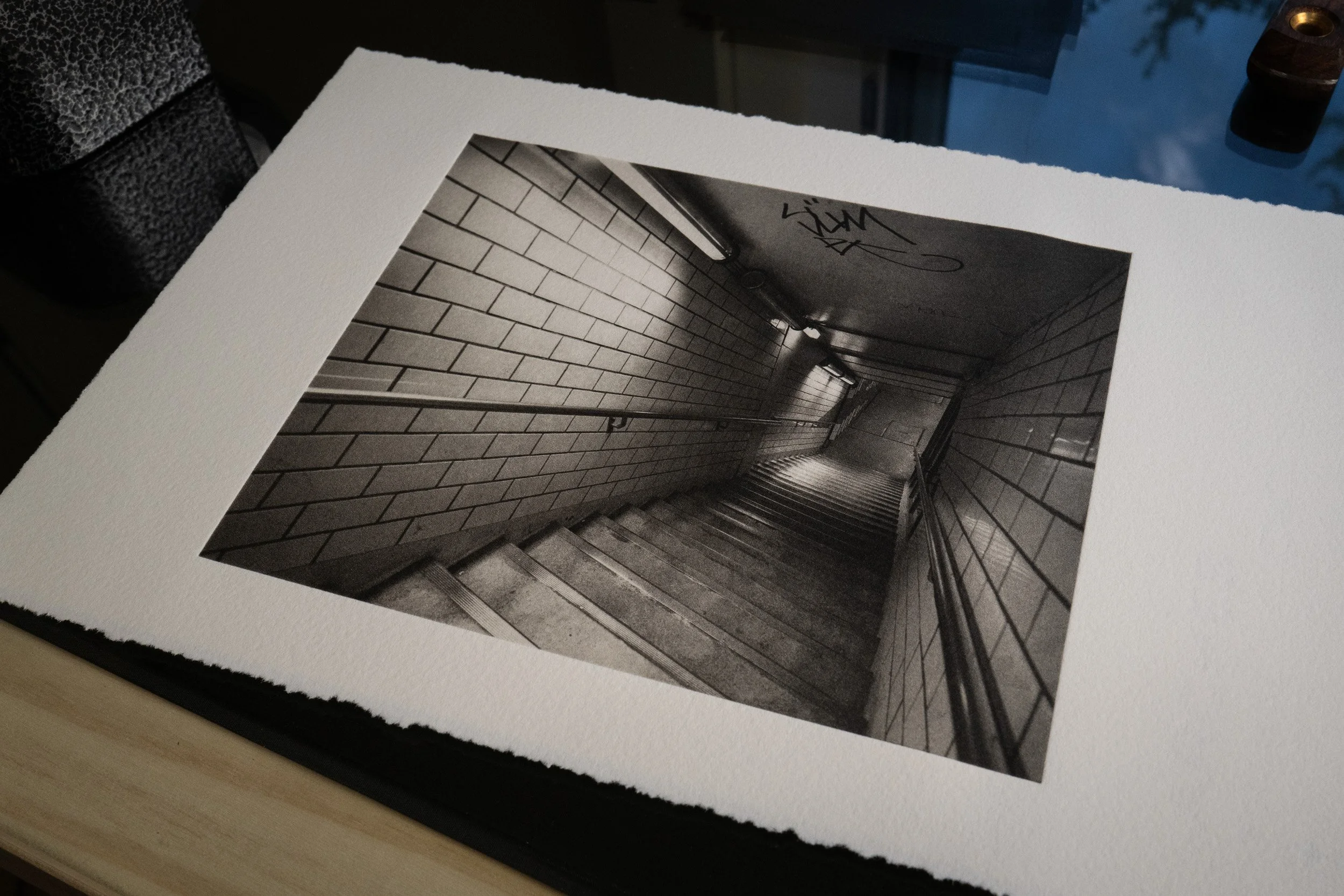 Photogravure print of stairs descending into the metro, Paris.