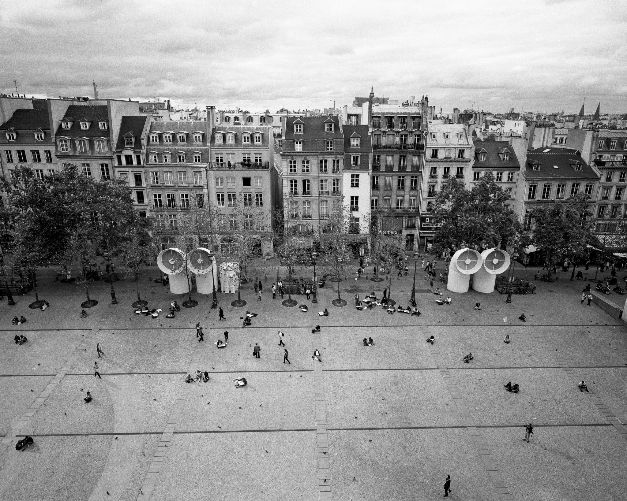 Black-and-white photograph of a street scene from The Centre Pompidou, Paris.