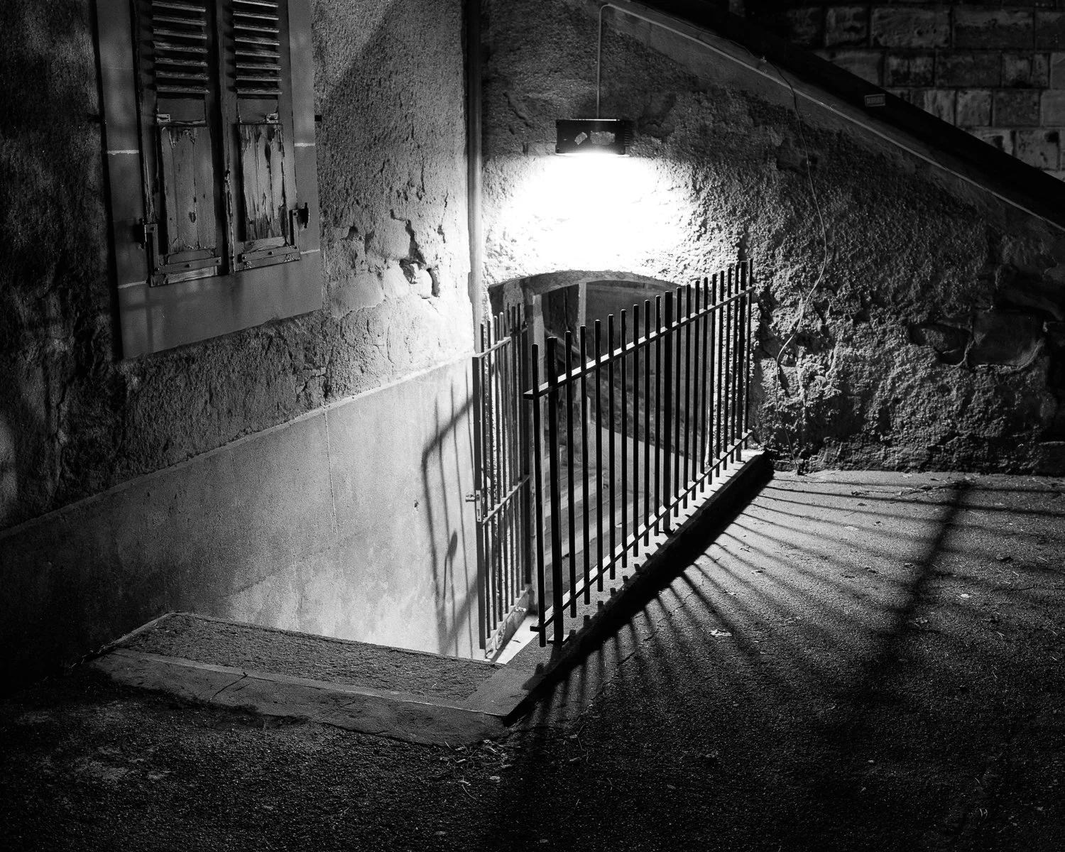 Black-and-white street photograph of stairs at night, Lausanne.