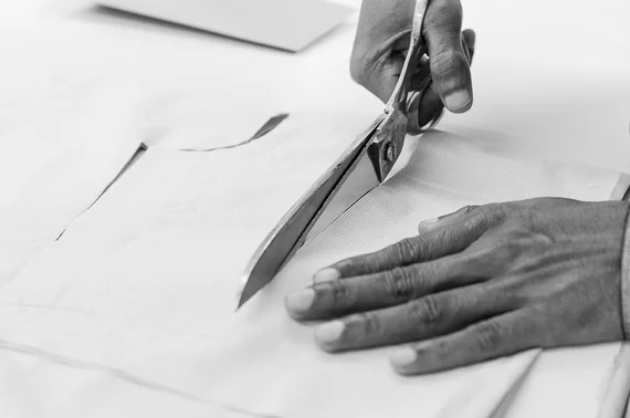 100Hands cut material by hand with scissors for all parts of the shirt. The level of pattern matching is very precise, which cannot be achieved by computer. (Image - 100Hands)
