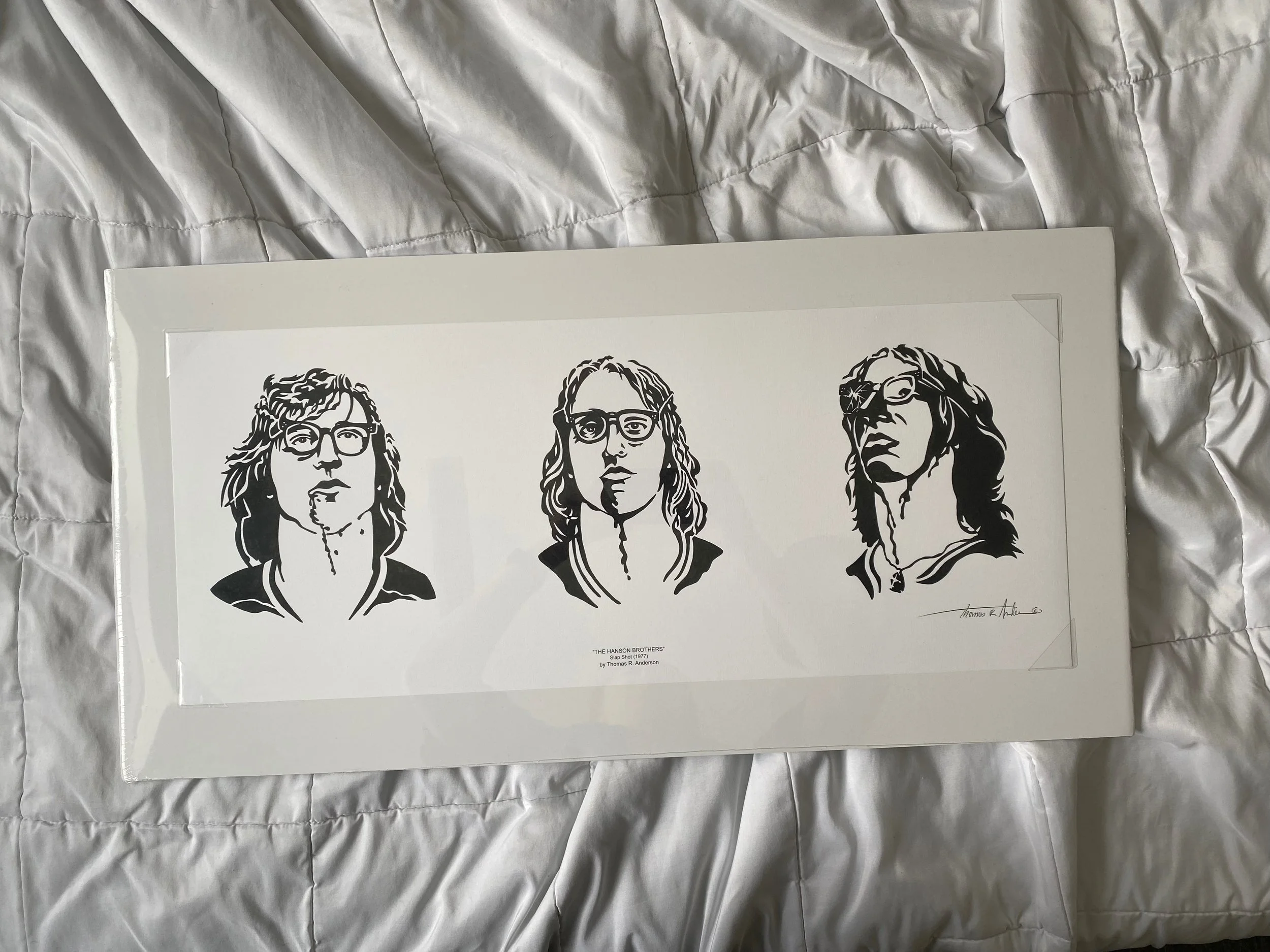 Black and white pen and ink illustration of the Hanson Brothers from the film Slap Shot