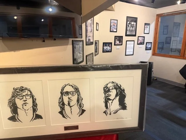 Black and white pen and ink illustration of the Hanson Brothers from Slap Shot displayed in First Summit Arena in Johnstown, Pennsylvania, original filming location of the movie