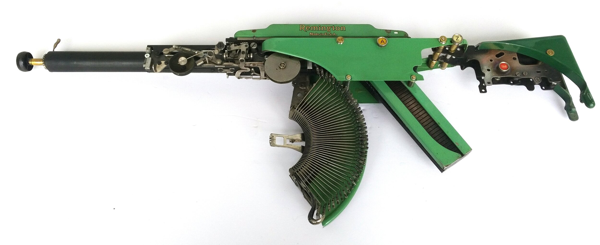  Eric Nado  - Rem Green AZ TAB  - Typewriter MachineGun series- Size: 11" x 30" x 3” inches. Transformed vintage Remington typewriter gun- SOLD 