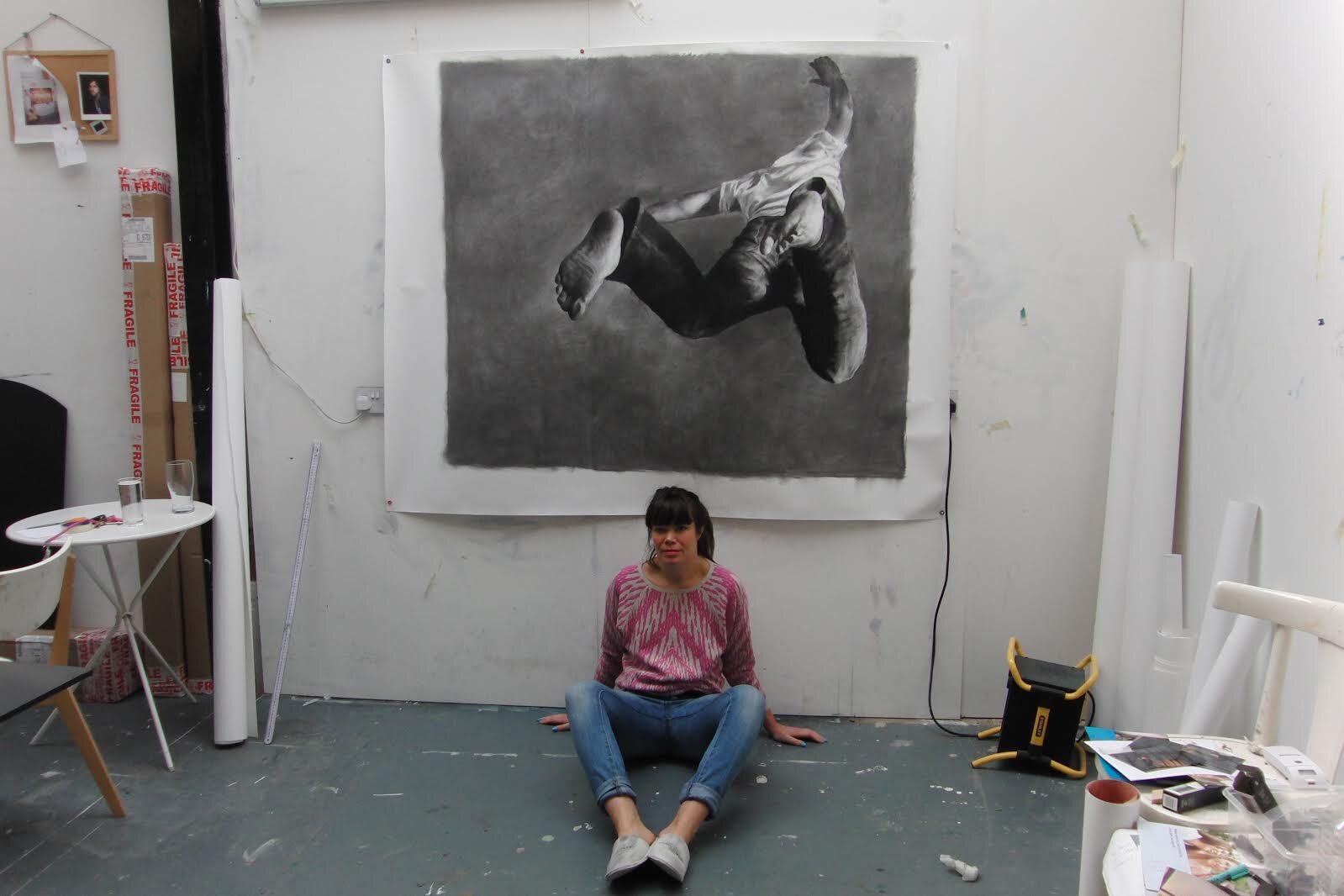 Patsy with artwork in her studio.jpg