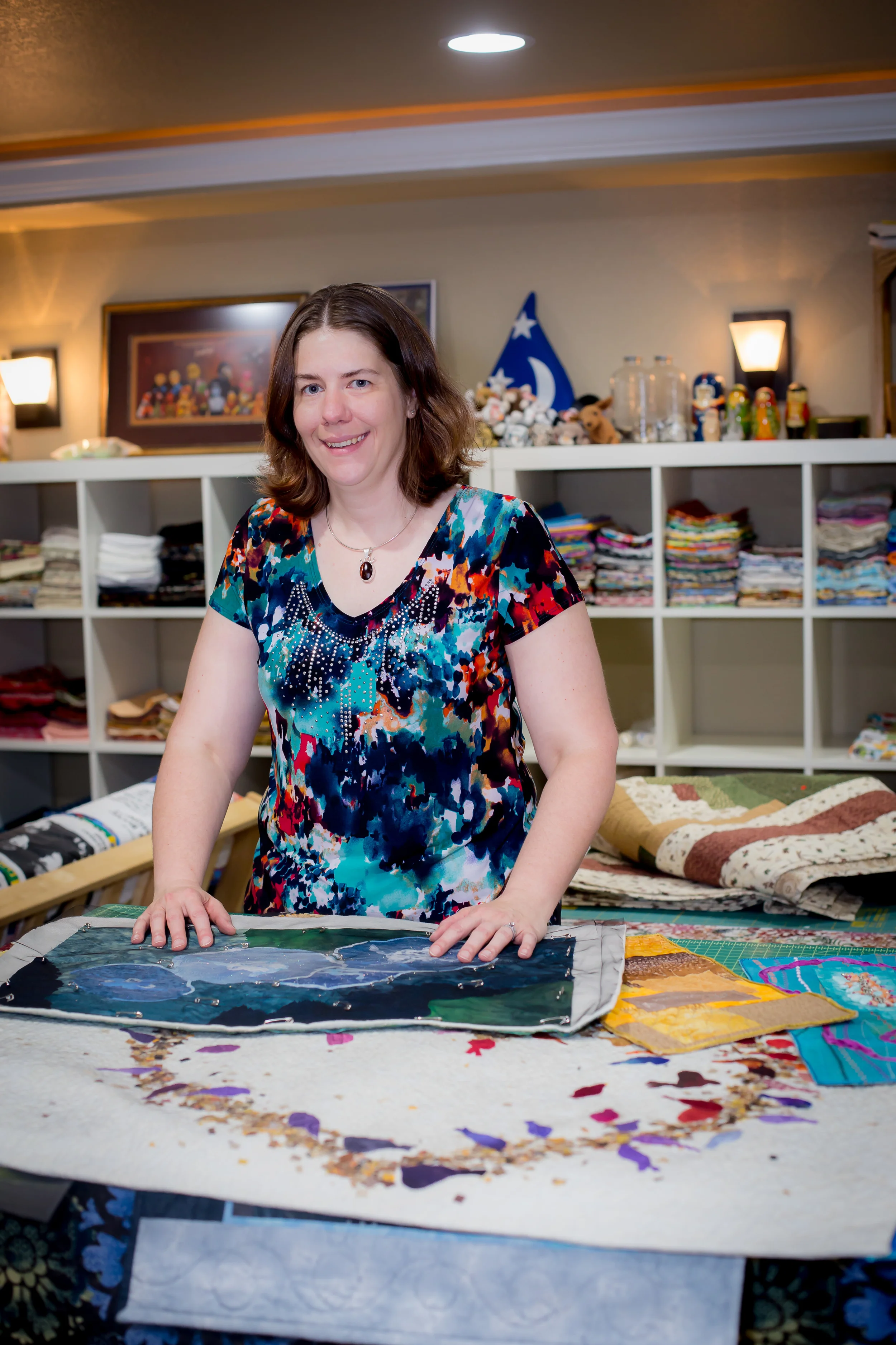 Rebecca Musgrave Textile/Fiber Art
Normal
0
false
false
false
EN-US
JA
X-NONE
/* Style Definitions */
table.MsoNormalTable
{mso-style-name:"Table Normal";
mso-tstyle-rowband-size:0;
mso-tstyle-colband-size:0;
mso-style-noshow:yes;
mso-style-priority:99;
mso-style-parent:"";
mso-padding-alt:0in 5.4pt 0in 5.4pt;
mso-para-margin:0in;
mso-para-margin-bottom:.0001pt;
mso-pagination:widow-orphan;
font-size:12.0pt;
font-family:Cambria;
mso-ascii-font-family:Cambria;
mso-ascii-theme-font:minor-latin;
mso-hansi-font-family:Cambria;
mso-hansi-theme-font:minor-latin;}
I initially became a quilter as creative escape from my day job staring at a flickering screen as a software test engineer. I started with traditional bed quilts and T-shirt quilts and grew into pictorial art and abstract mixed media fiber wall hangings. Doing custom work, like pet portraits, baby, and memory quilts energizes me. When I’m working on a new project I can often be found fondling fabric in local quilt shops. Visit Artist's Website