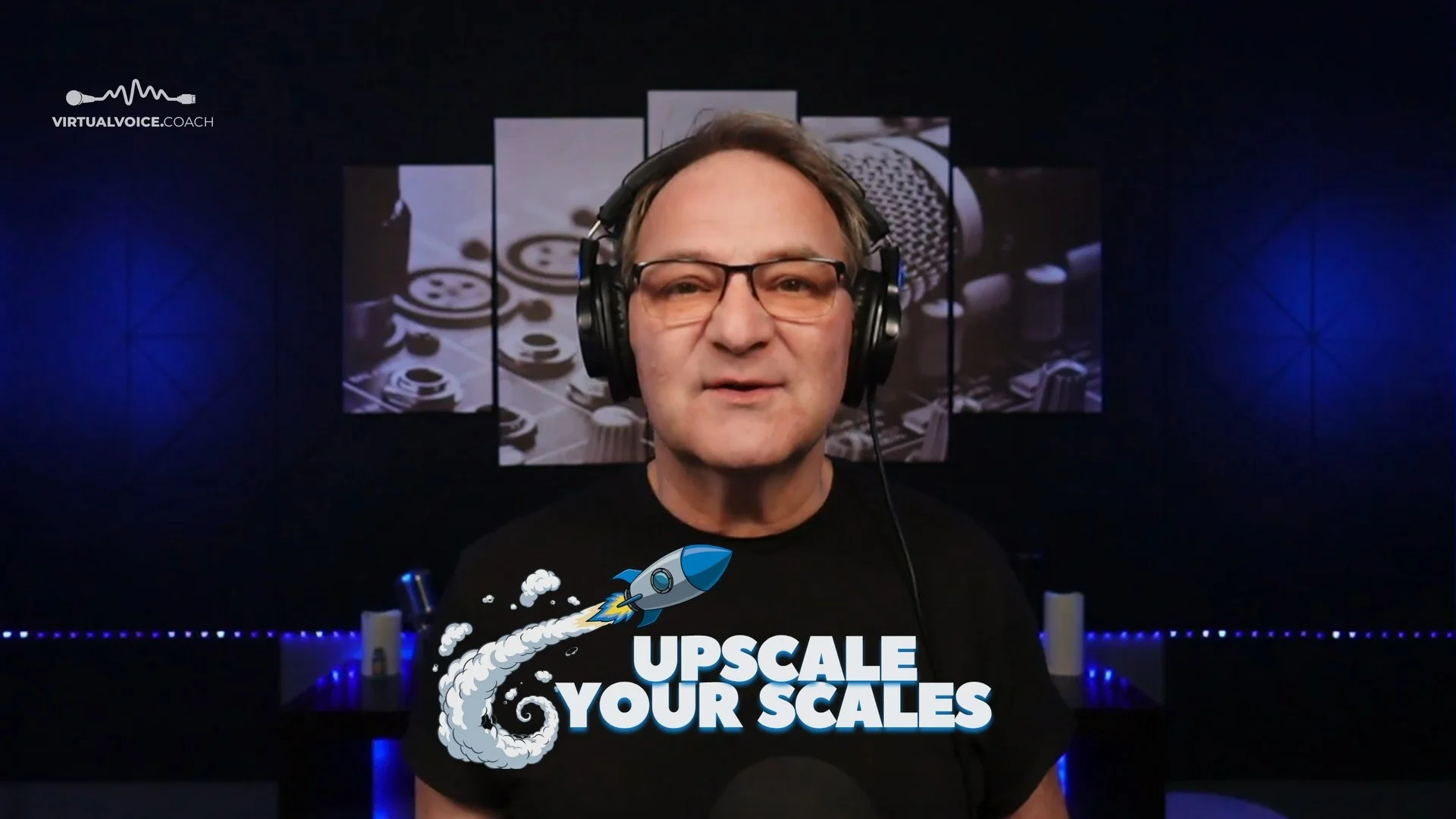 A man wearing glasses and headphones in a recording studio with a background of microphones and audio equipment, and a graphic overlay that says 'Upscale Your Scales' with a rocket illustration.