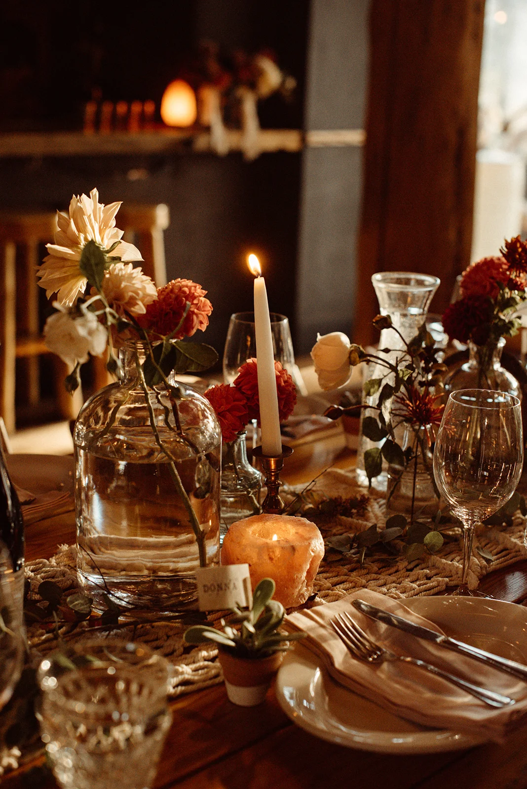 An intimate boho vibe at Suttle Lake Lodge . Photography Kat Gillespe , Coordination Ella Events , Florals HART Floral , decor and vintage glassware Curated .