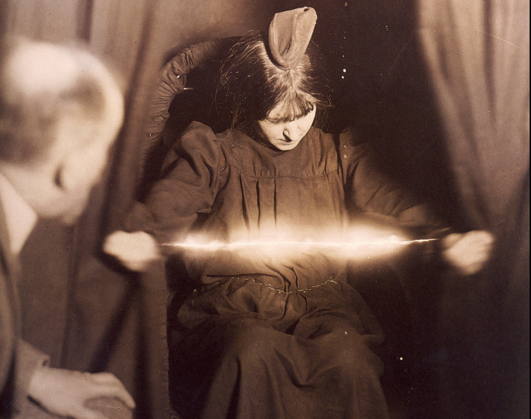 Albert von_Schrenck-Notzing_The_medium_Eva_C_with_a_materialization_on her_head