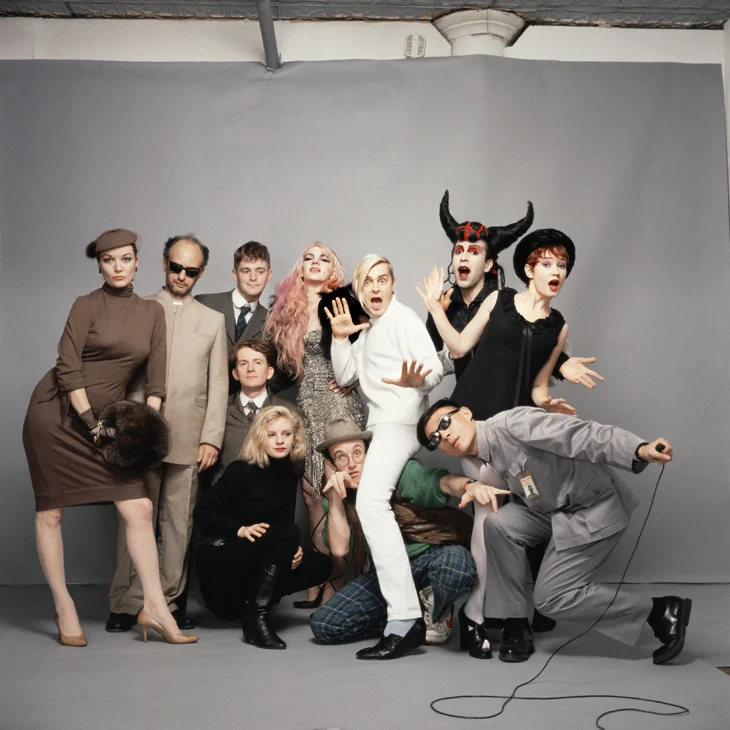Tseng Kwong Chi Art After Midnight (New York), 1985 Chromogenic print, 30 x 30 in. © Muna Tseng Dance Projects, Inc. Standing from left: Patti Astor, Steve Maas, Peter McGough, Animal X, John Sex, Joey Arias, Ann Magnuson. Kneeling from left: David McDermott, Min Thometz-Sanchez, Keith Haring, Tseng Kwong Chi