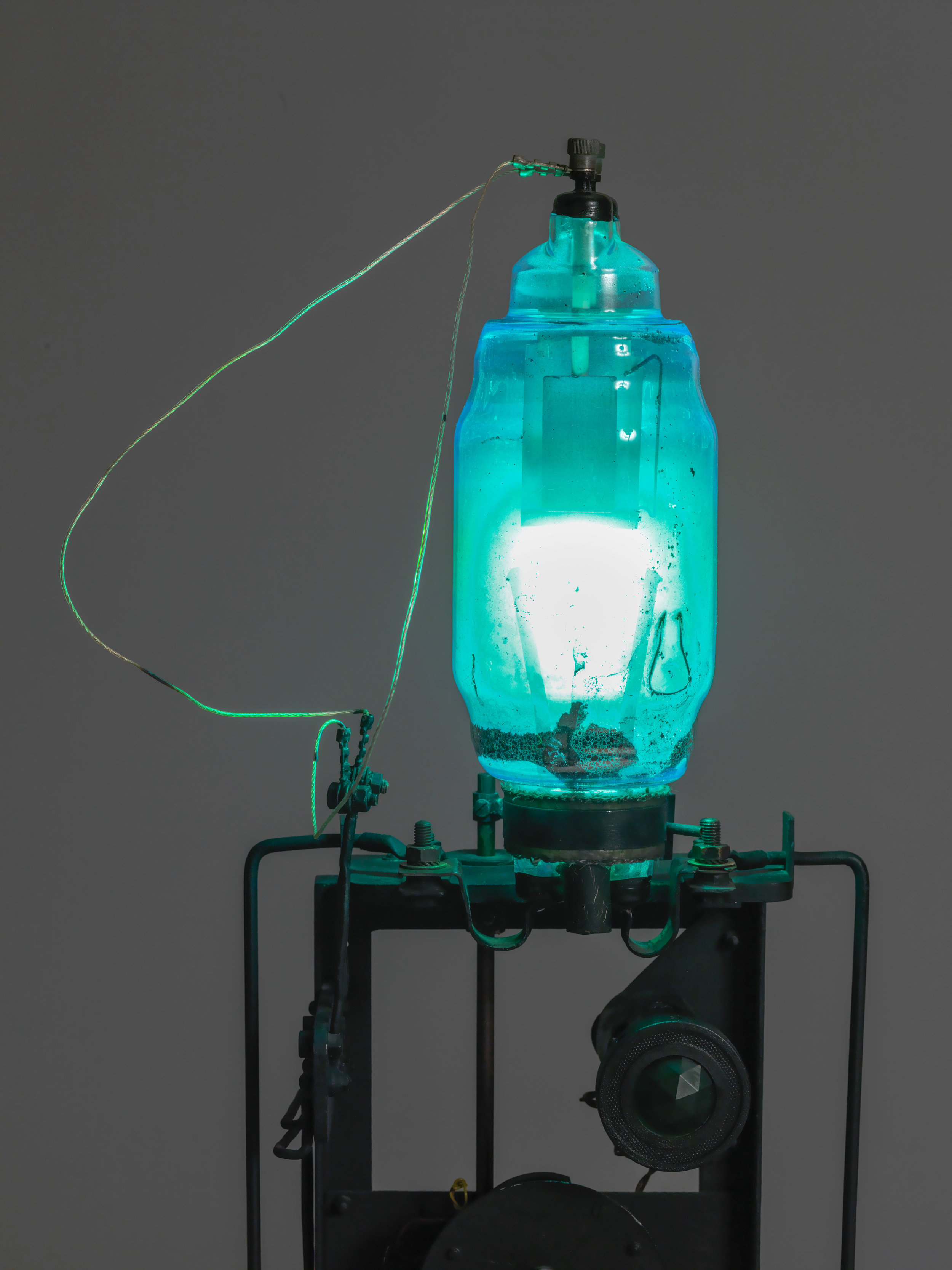   Télélumière No. 4  (detail) 1963–4 Iron machine parts, light bulbs, wood, brass, steel, electromagnet, string, and paint 108 × 30 × 32 cm, 30 x 60 cm approx. Tate. Purchased with assistance from Tate International Council, Tate Members, Tate Patron