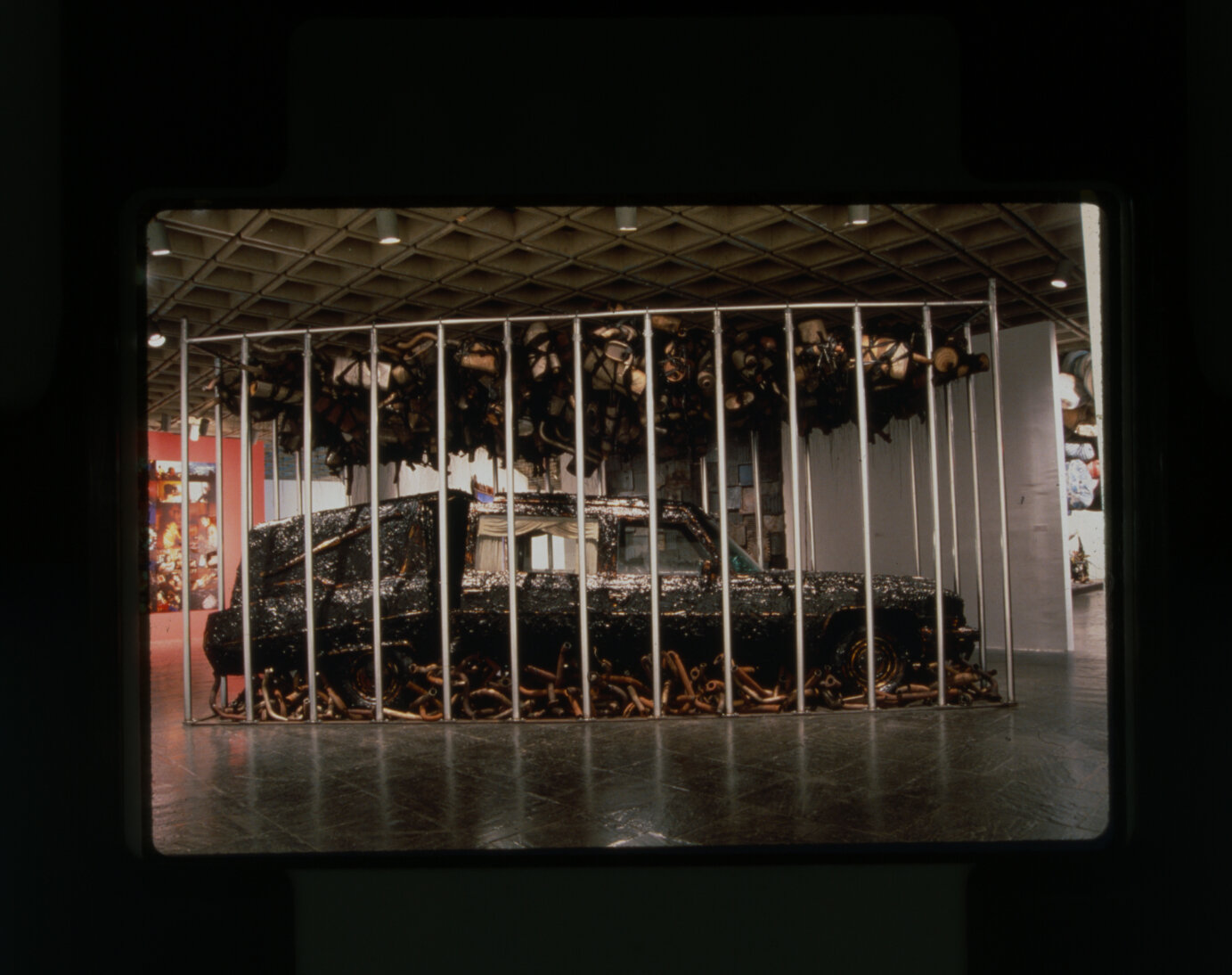  Nari Ward  Peace Keeper , 1995 Hearse, grease, mufflers, and feathers   144 x 116 x 264 in (365.8 x 294.6 x 670.6 cm) Installation views: Whitney Museum of American Art, New York, 1995. Courtesy the artist, Lehmann Maupin, New York, Hong Kong, and S