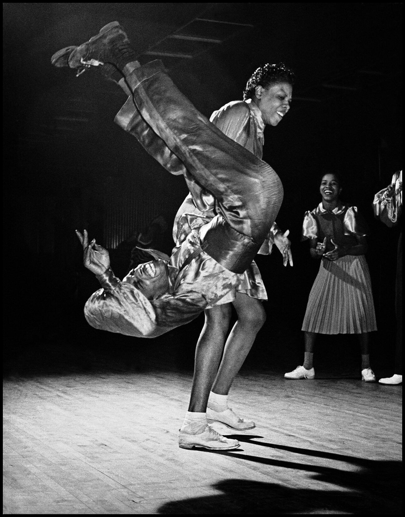  CORNELL CAPA/MAGNUM PHOTOS Gladys Crowder and Eddie "Shorty" Davis. Two of the great Lindy Hop dancers, in the Kat's Corner at the Savoy Ballroom. Harlem, New York City, USA. 1939. 
