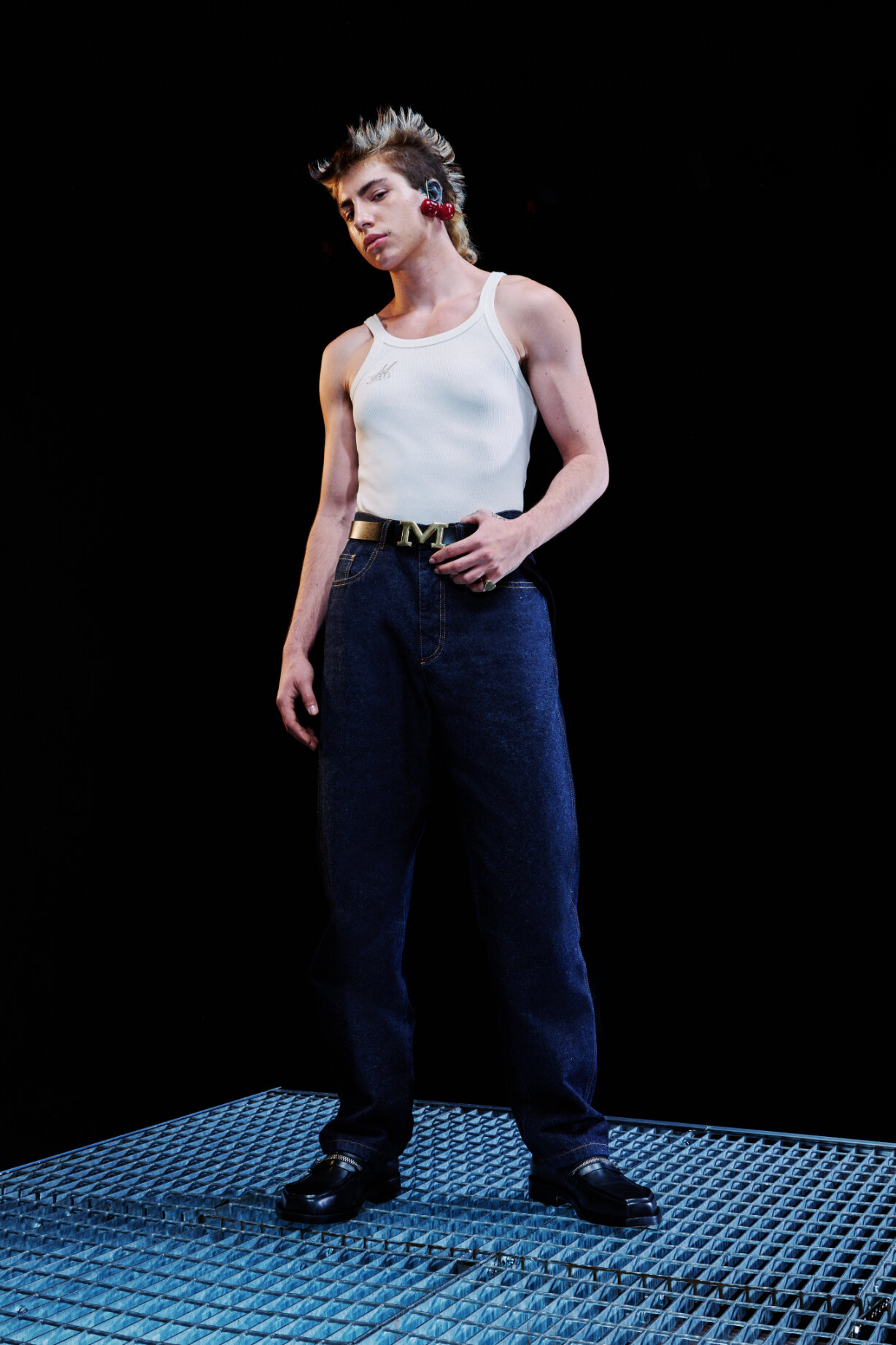  Model wears white tank top and jeans for Magliano's Spring/Summer 2022 collection for Milan Fashion Week. 