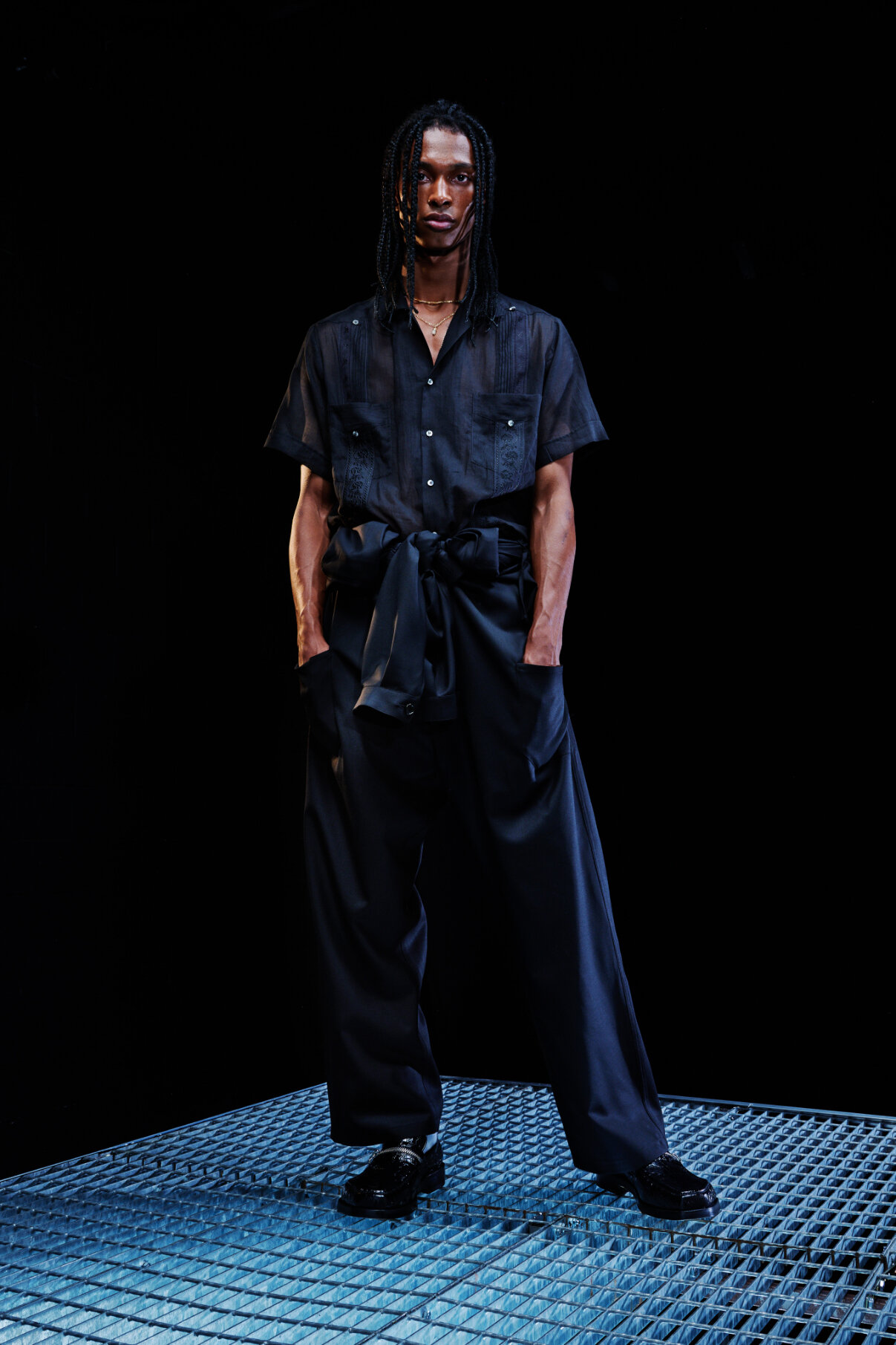  Model wears black button up and slacks for Magliano's Spring/Summer 2022 collection for Milan Fashion Week. 