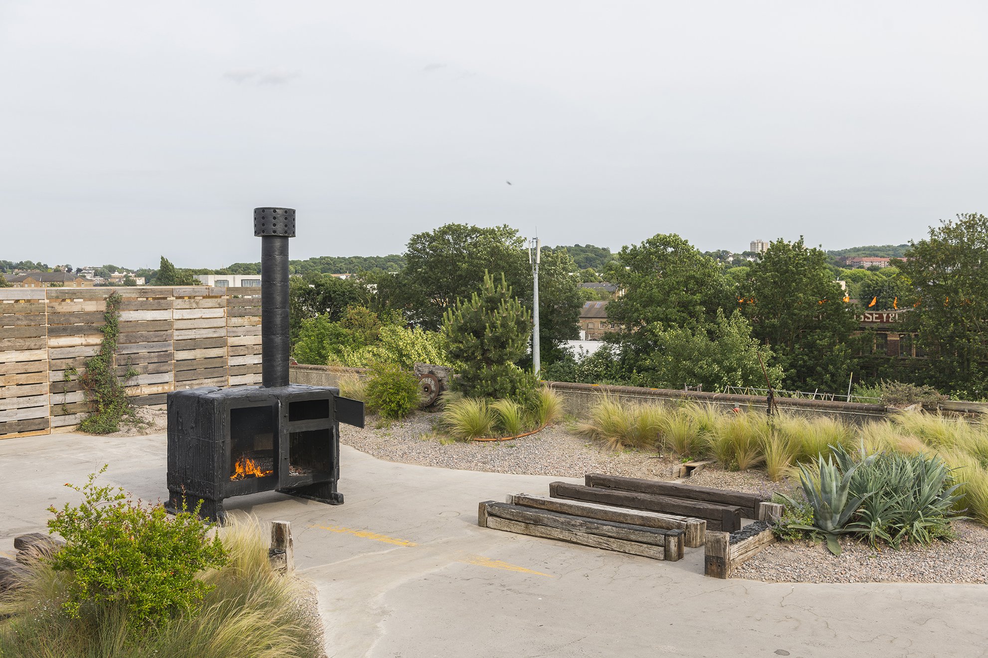  Sterling Ruby’s BLACK STOVE 3 (2014) installed in the Derek Jarman Garden at Bold Tendencies as part of their 2018 programme on Ecology. © Damian Griffiths 