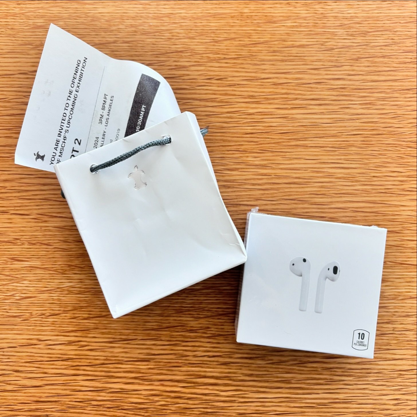 April Fools! What we thought were a new pair of AirPods is actually an invite to @mschf &lsquo;s upcoming exhibition at @perrotin LA. The logo with two bites out the apple should have given it away, even the receipt was convincing, and the AirPods ar