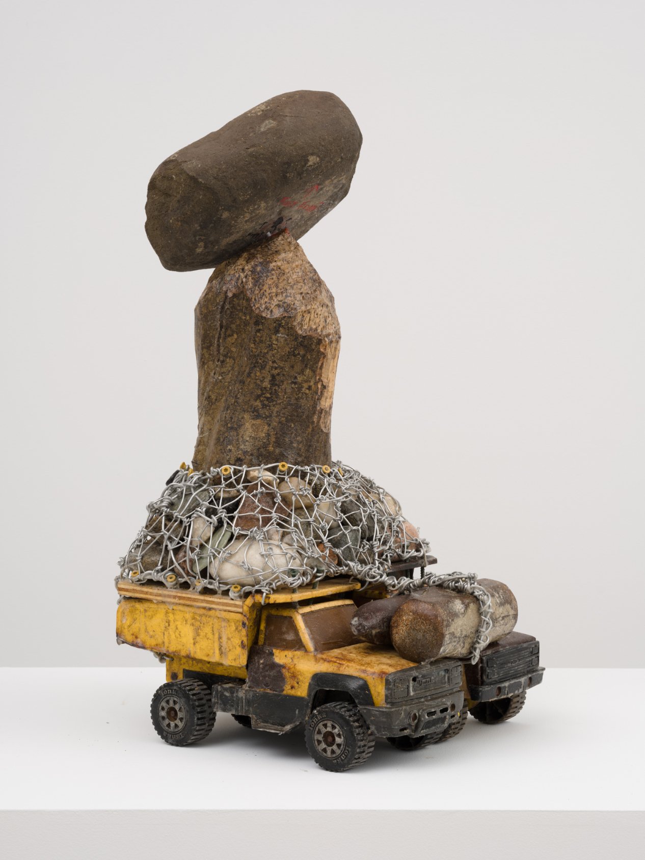  Arthur Simms  Stone on Top , 2020 Stone, rocks, glass, wood, wire, iron, screws, toy trucks, and cork 25 × 16 × 12 ½ in. © Arthur Simms. Courtesy the artist and Karma 