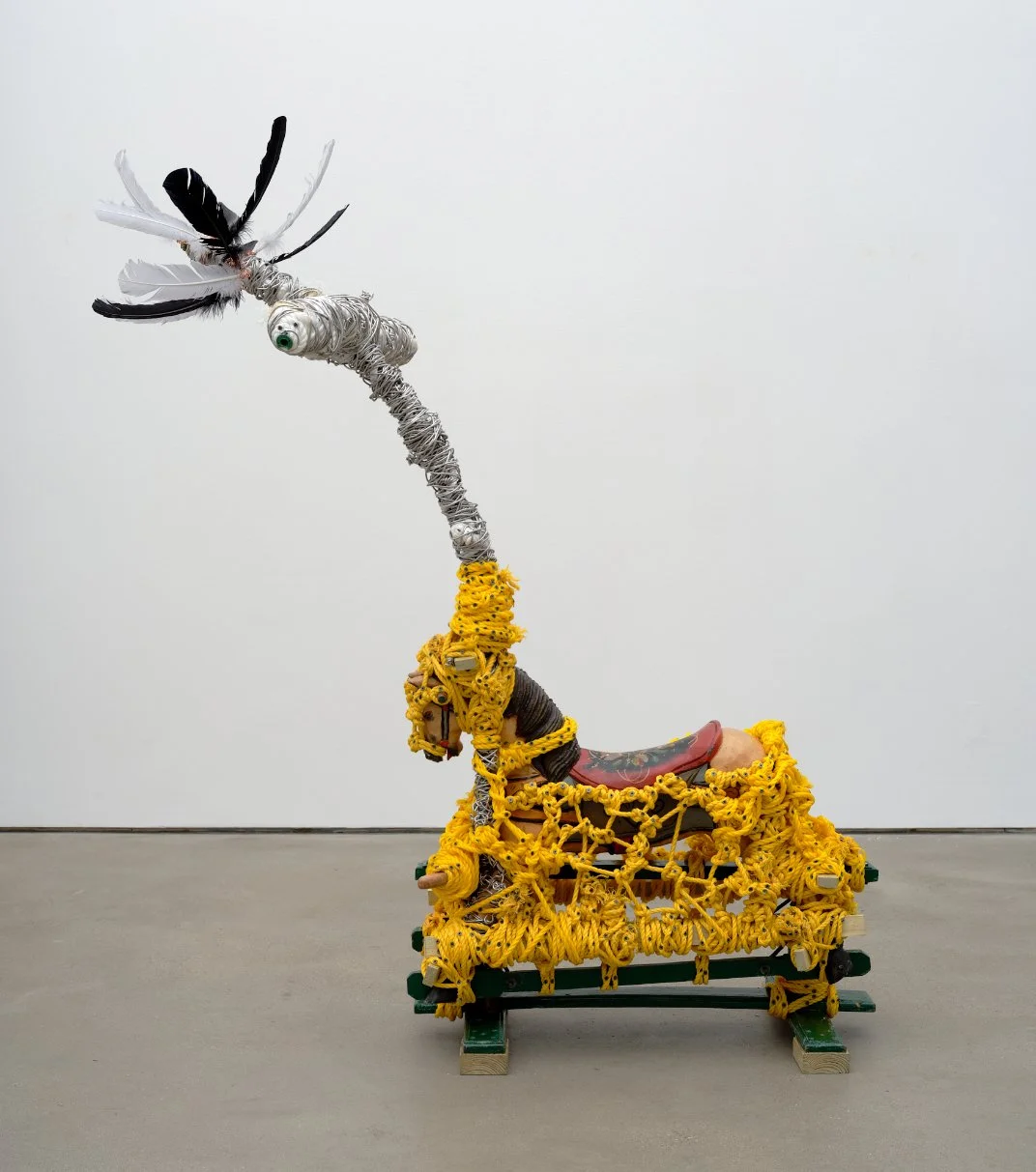  Arthur Simms  Conquistador in the New World , 2024 Feathers, wire, rope, toy horse, wood, screws, glue, and plastic spools 69 ¼ x 59 ¾ x 27 ½ in. © Arthur Simms. Courtesy the artist and Karma 