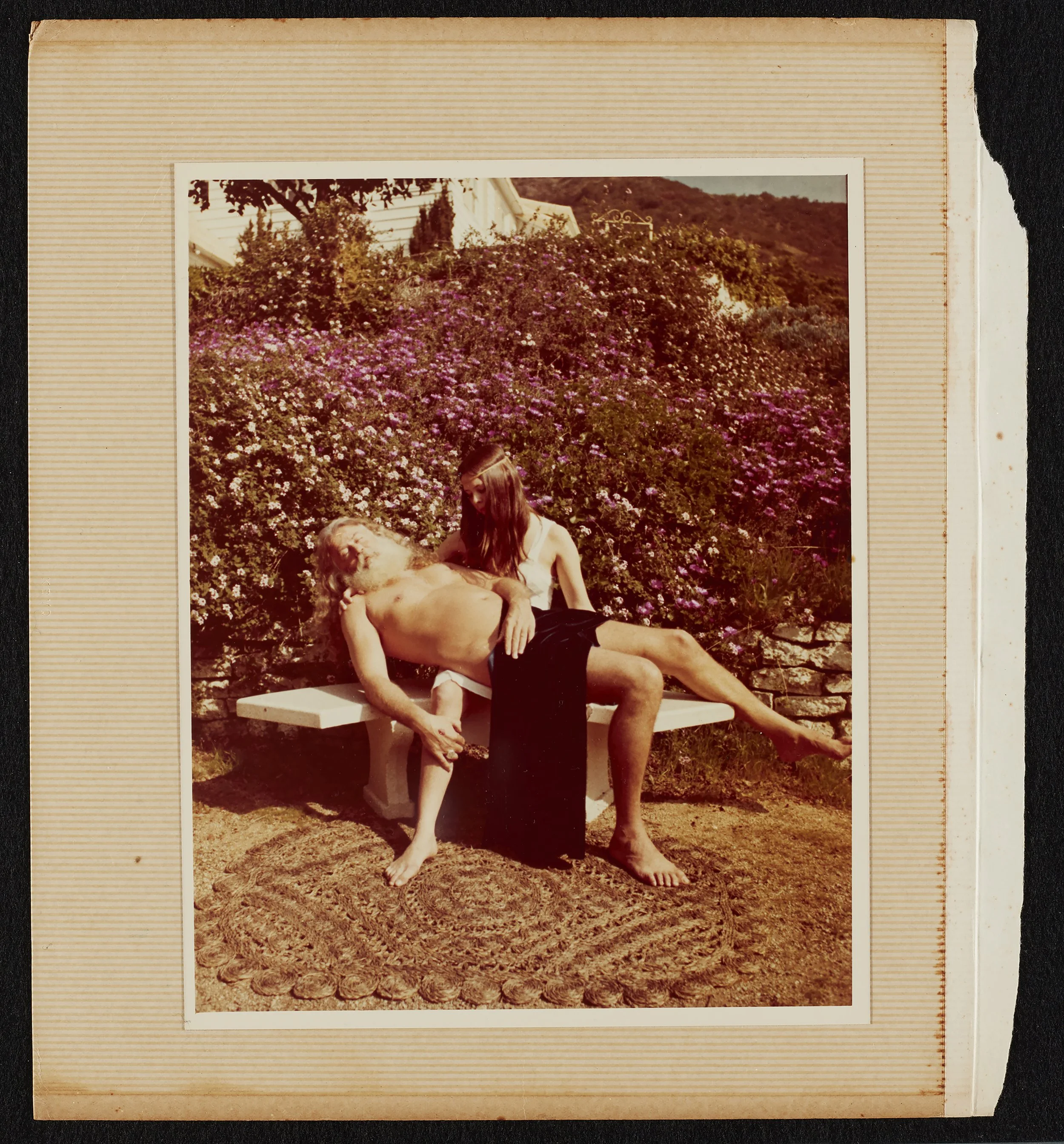 An image of a young woman carrying an old man