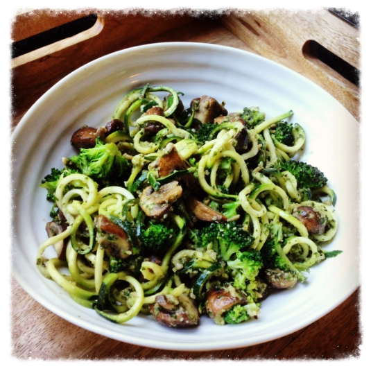Bowl of healthy, courgetti gluten free pasta with homemade dairyfree pesto.