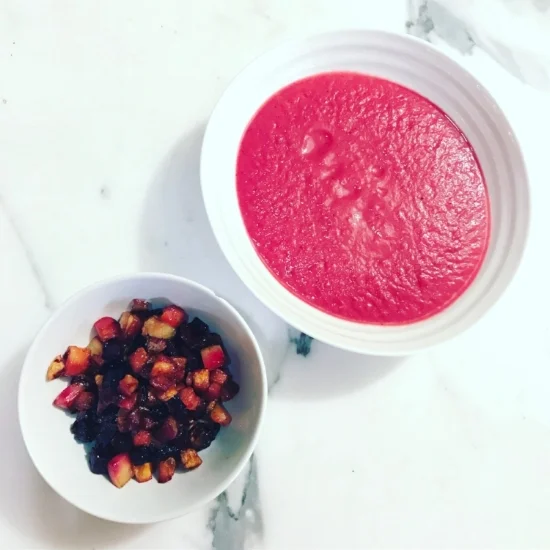 Healthy, homemade pink beetroot soup with nutritious root vegetable croutons.