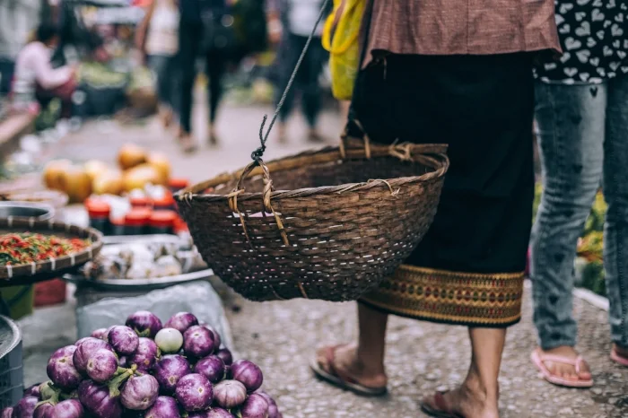 Lady in market of healthy organic food - fruit and vegetables