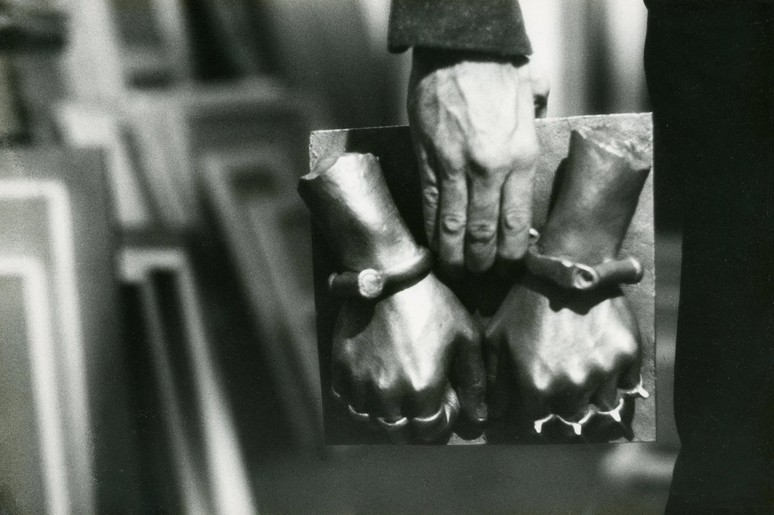 Bruno Caruso Holding a Bronze Cast of his Fists