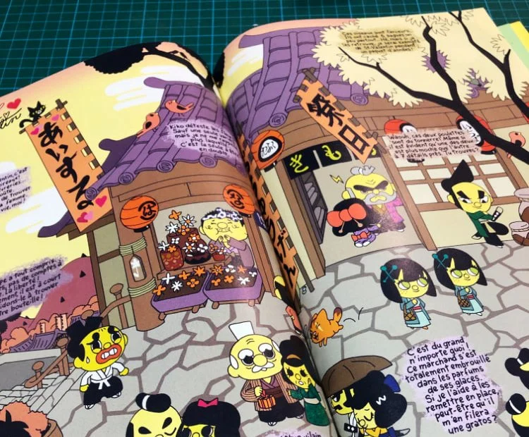 Le livre ouvert sur une double page dont la continuité est assurée