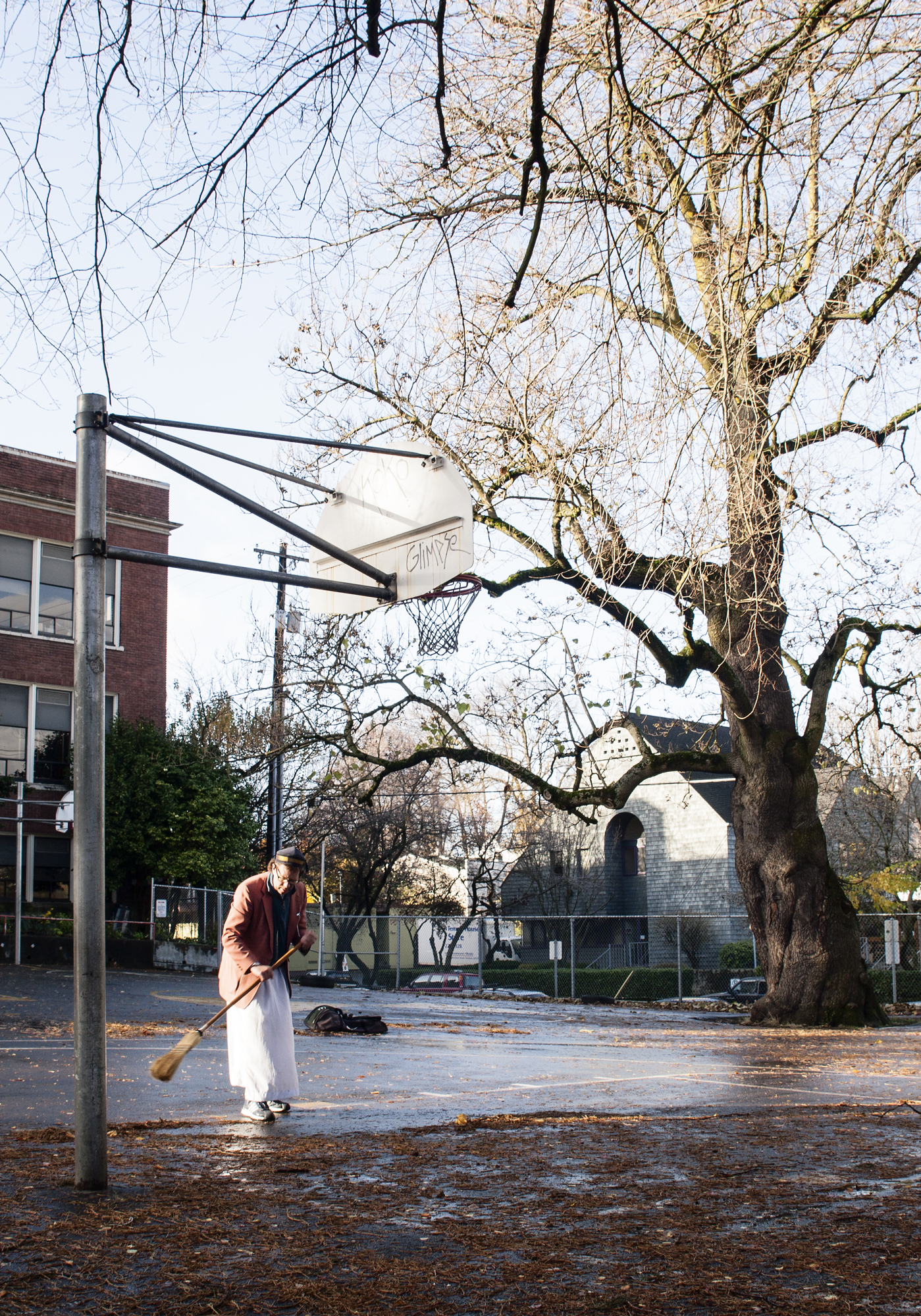 man_sweeping_basketball_court_web.jpg