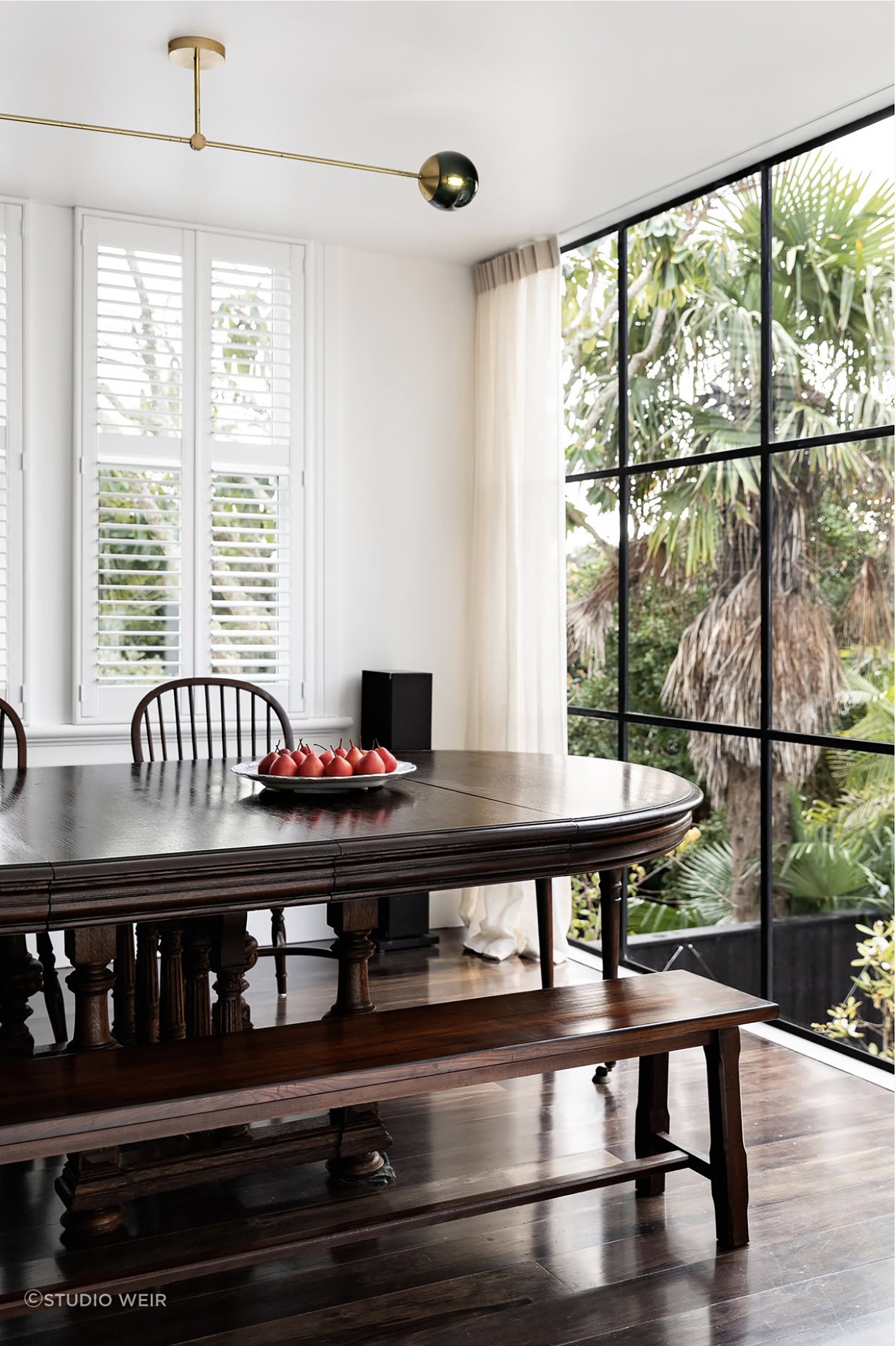 Dining room extension with floor to ceiling Crittall windows overlooking the raised pool and courtyard, Devonport Villa