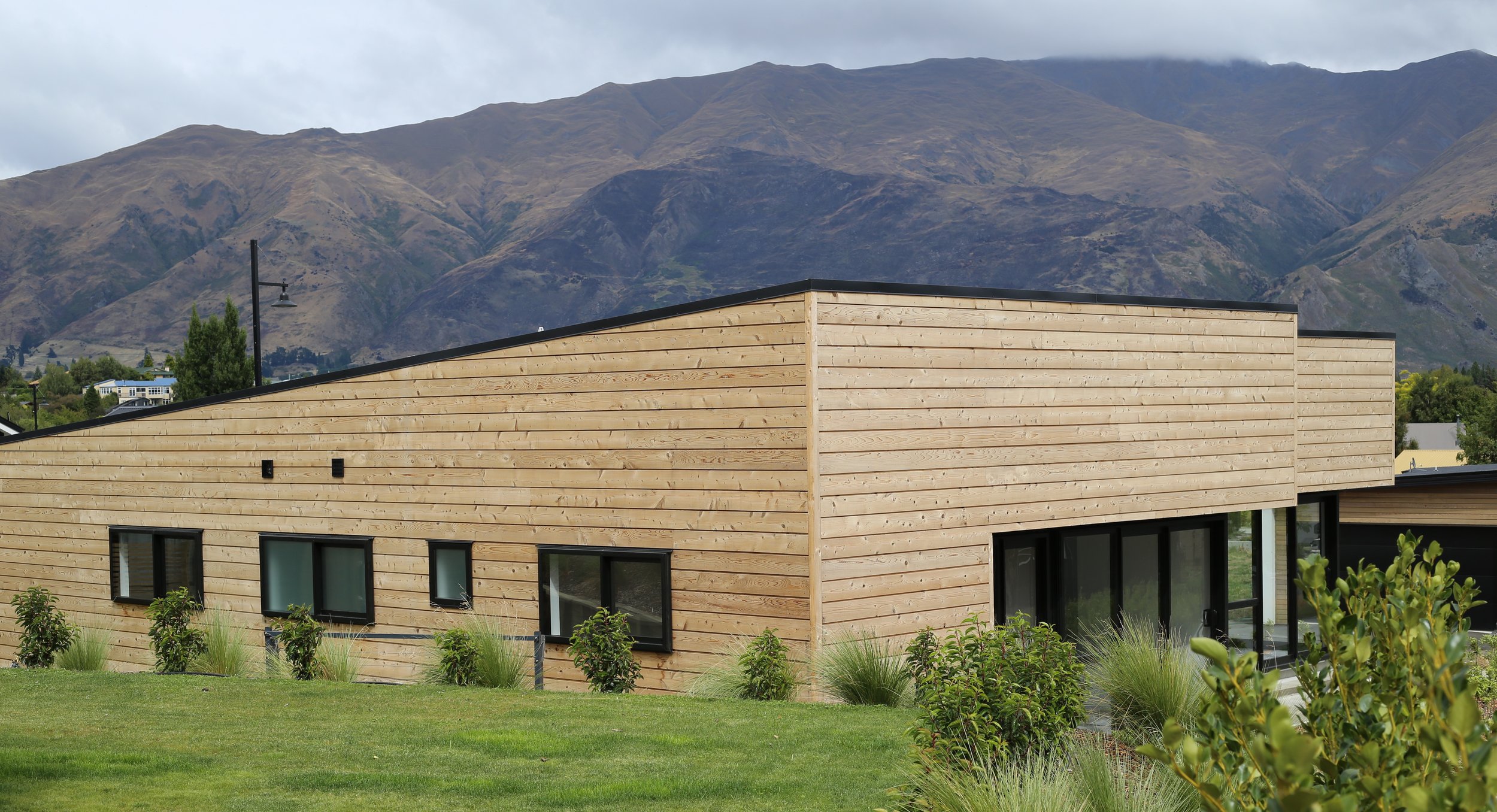 This is the same house as the first shot, from the other side.  Of the two, this is the stronger candidate for og:image. The ranges behind the house do more work than any description could, and it says Central Otago at a glance in a link preview.