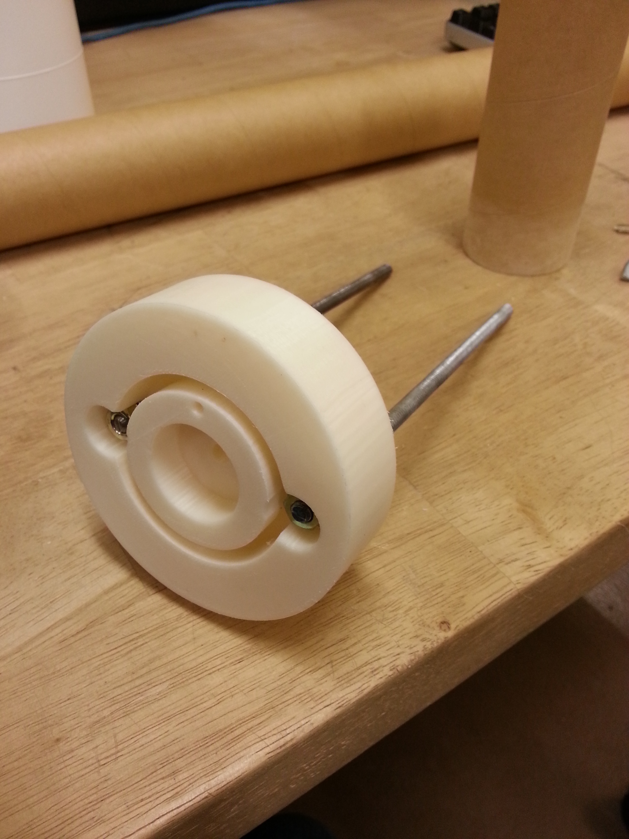 Hot out of the printer, this piece holds most of the nose cone system together. We have been very happy with the printed ABS structures so far.