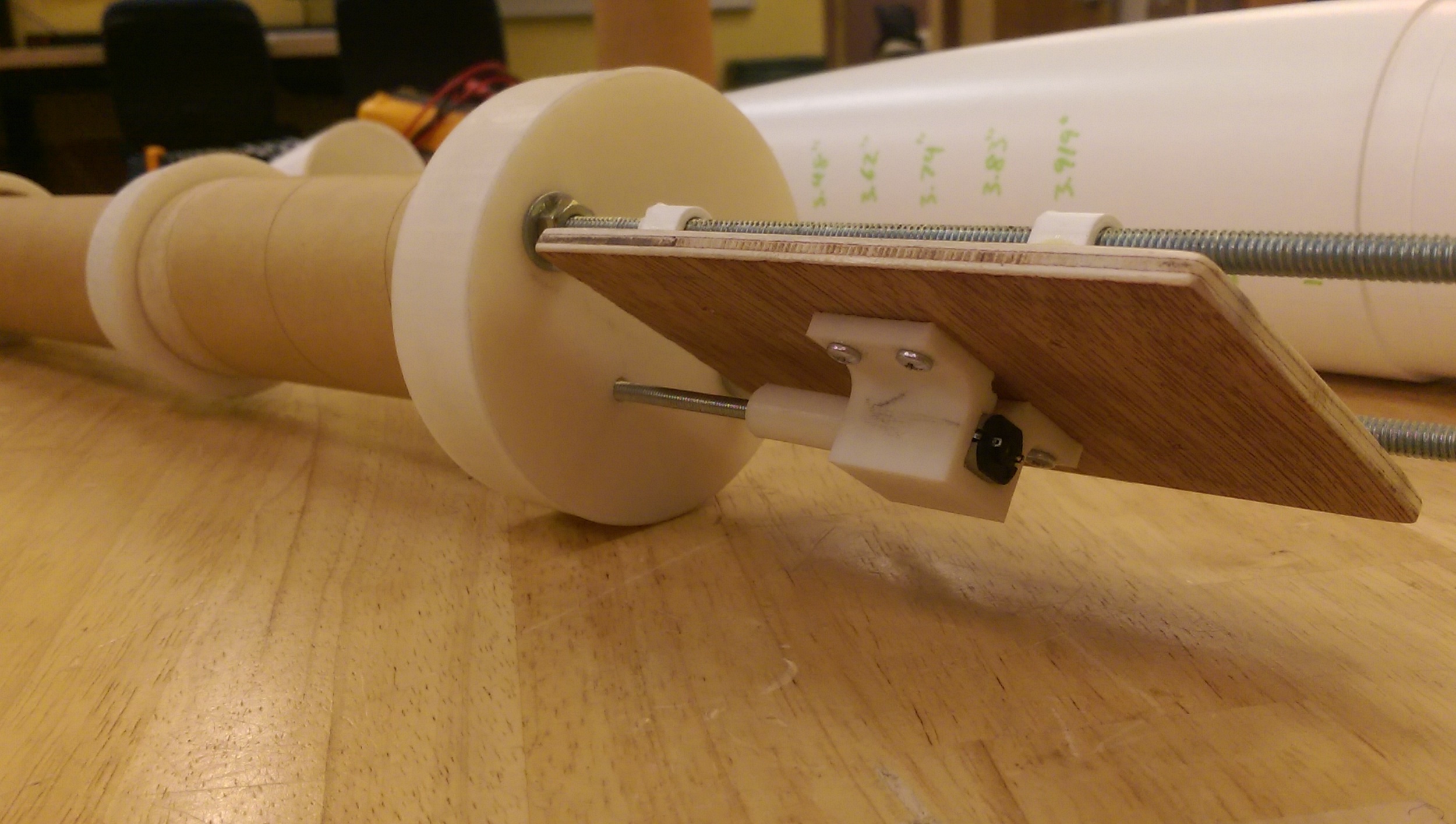 Teeny tiny motor, with a 100:1 gear reduction. Should close the nosecone right up.