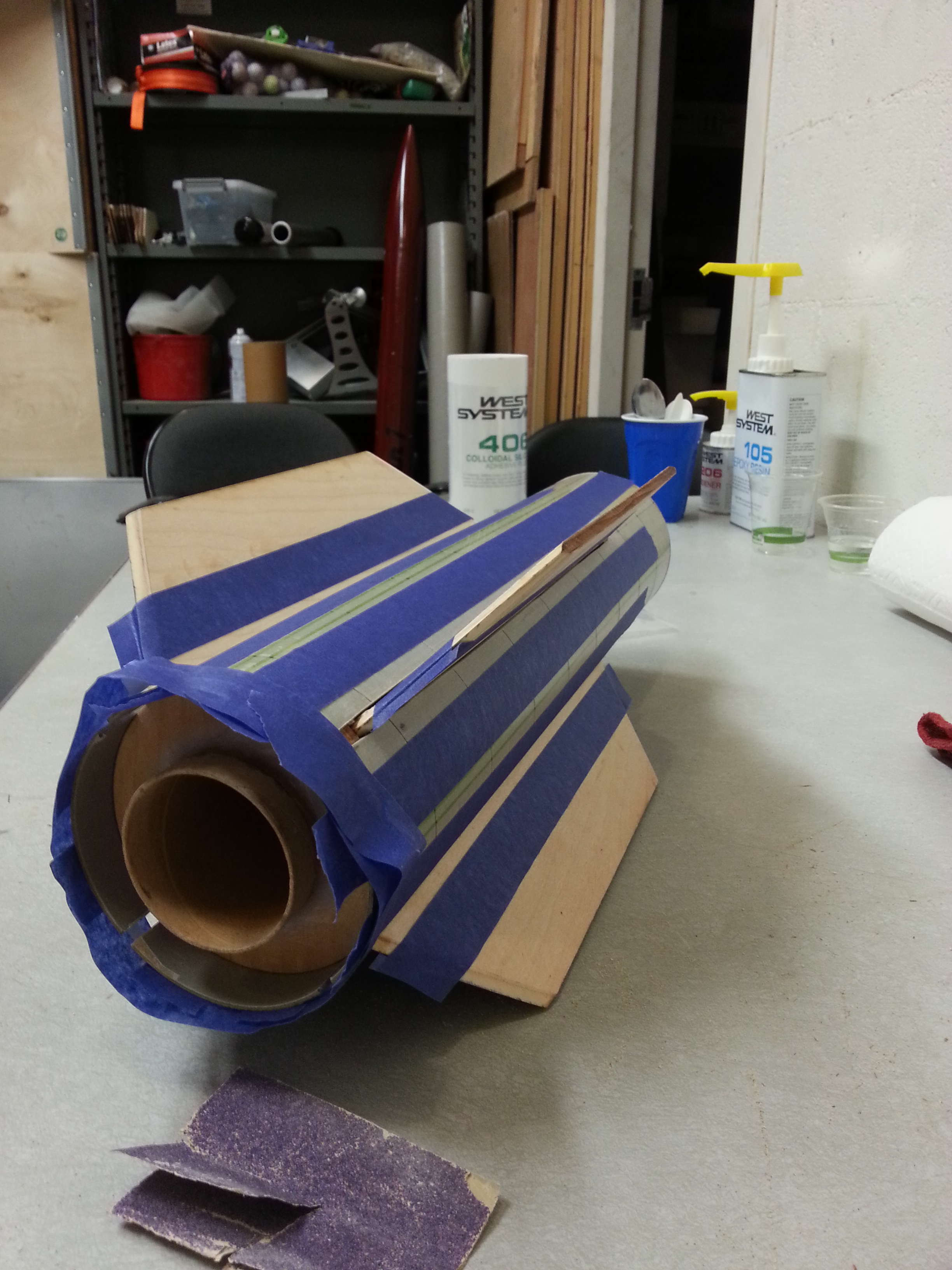 The fin sub-assembly is slid into the airframe and masked off, ready for some more epoxy work.