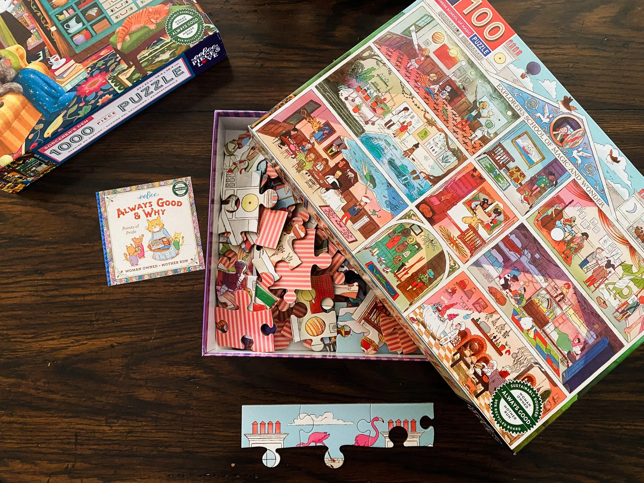 Open box of the Explorers School puzzle showing the pink striped tile backs