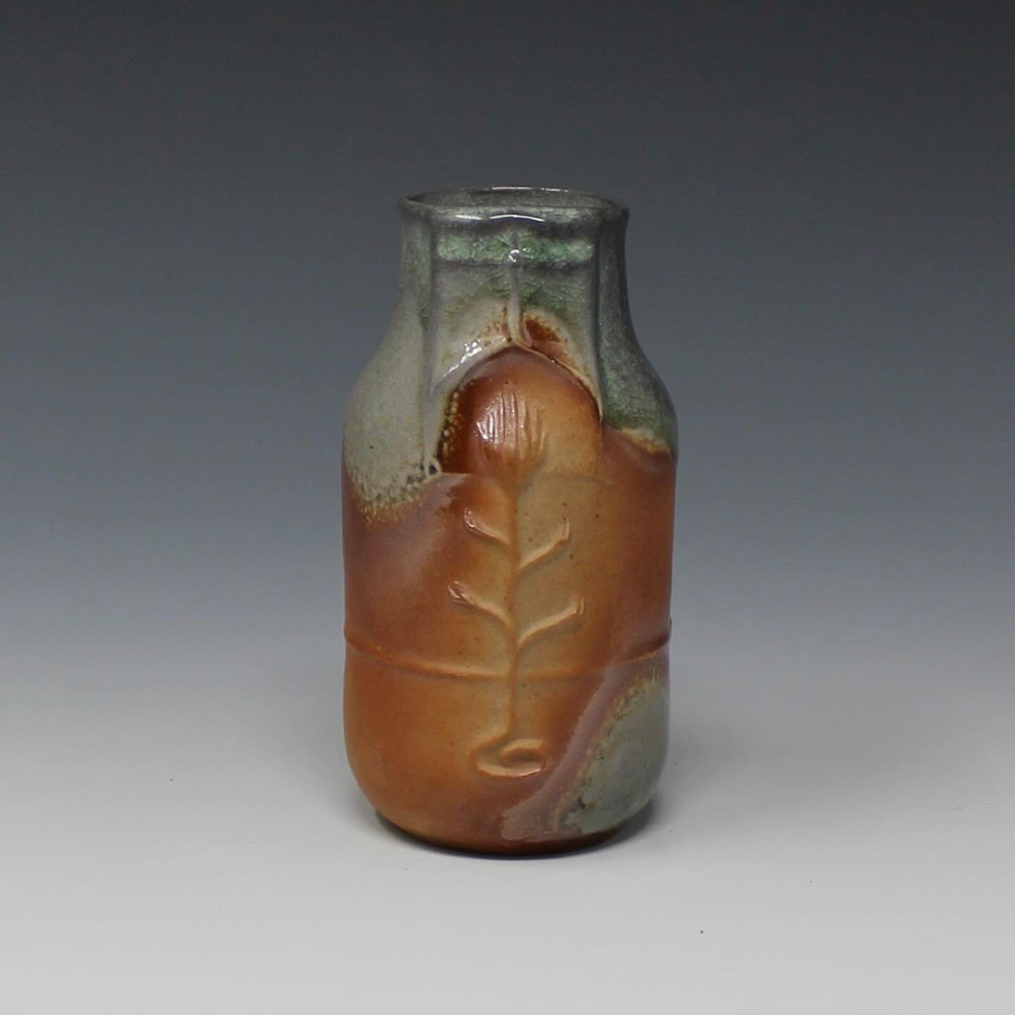 Today we are highlighting this gorgeous new piece from resident artist Harry Cassell (@sassafrassell) our upcoming online 2025 Holiday Sale &amp; Exhibition! 🎄🏺❄️ 🎁 ✨

⠀⠀ 
First Flame Vase
Slipcast, ^10 Soda-Fired
4&rdquo; x 2&rdquo; x 2&rdquo;
$6