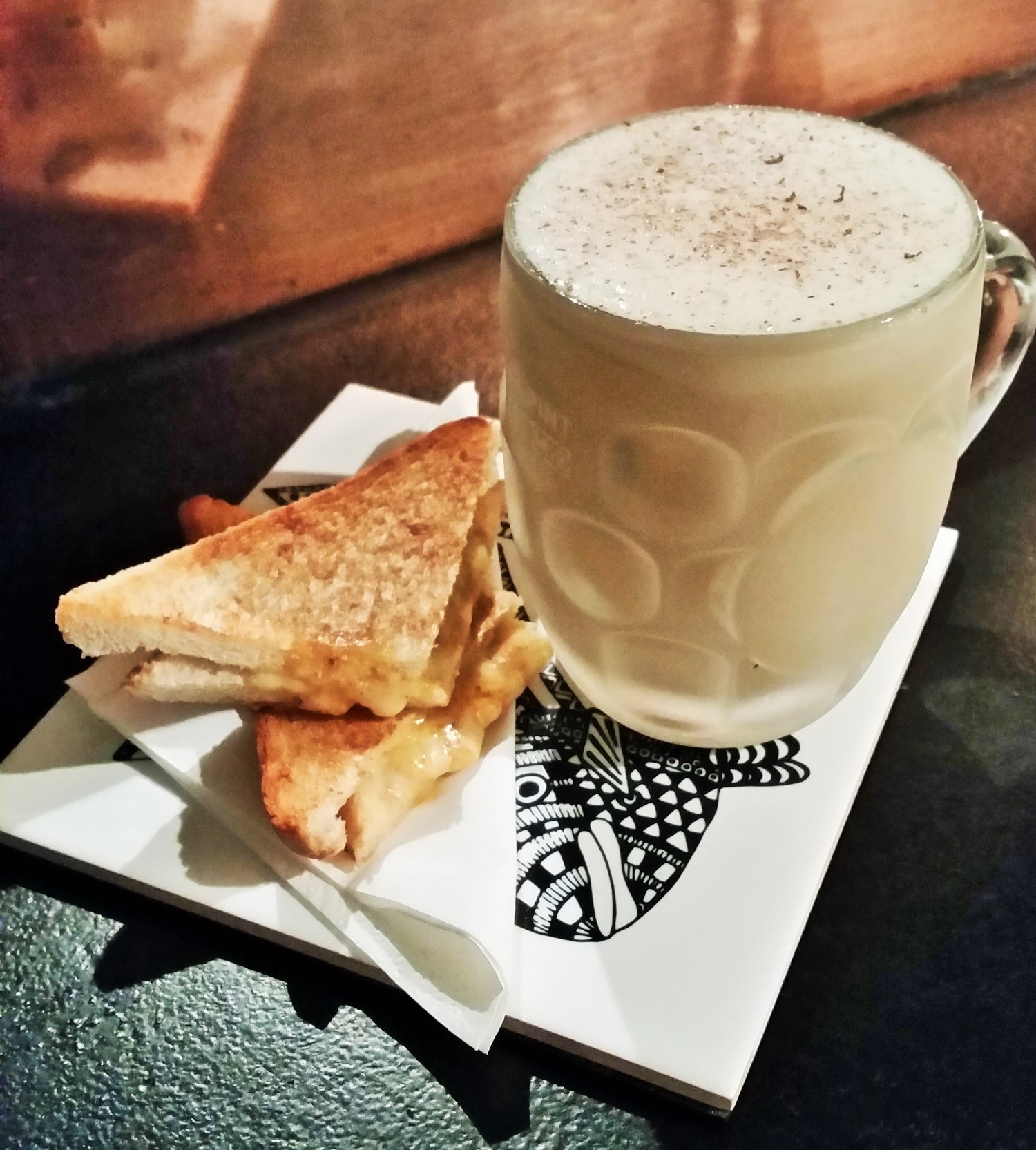 Stout Flip accompanied with melt in the mouth grilled cheeses.