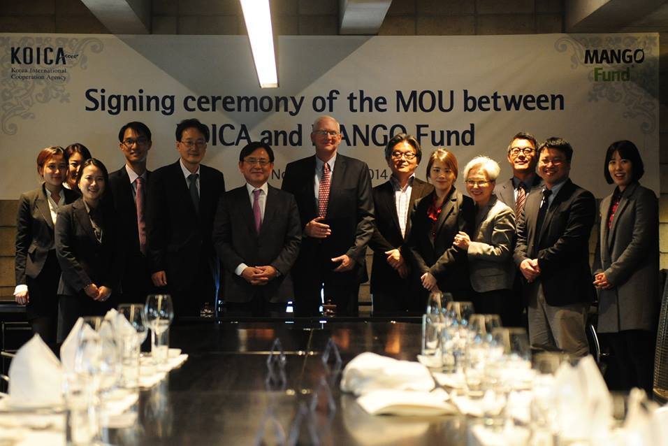   Andy Mills from Mango Fund with the KOICA team during the&nbsp;after signing the Memorandum of Understanding between the two organizations  