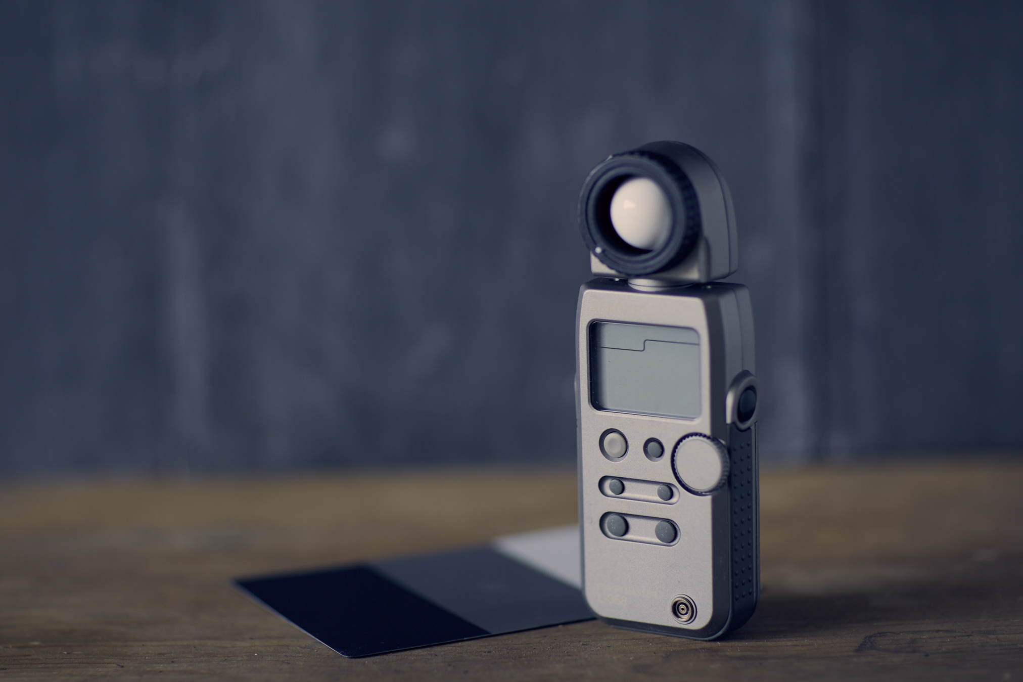 Sekonic L-358 Light meter + Grey card behind.