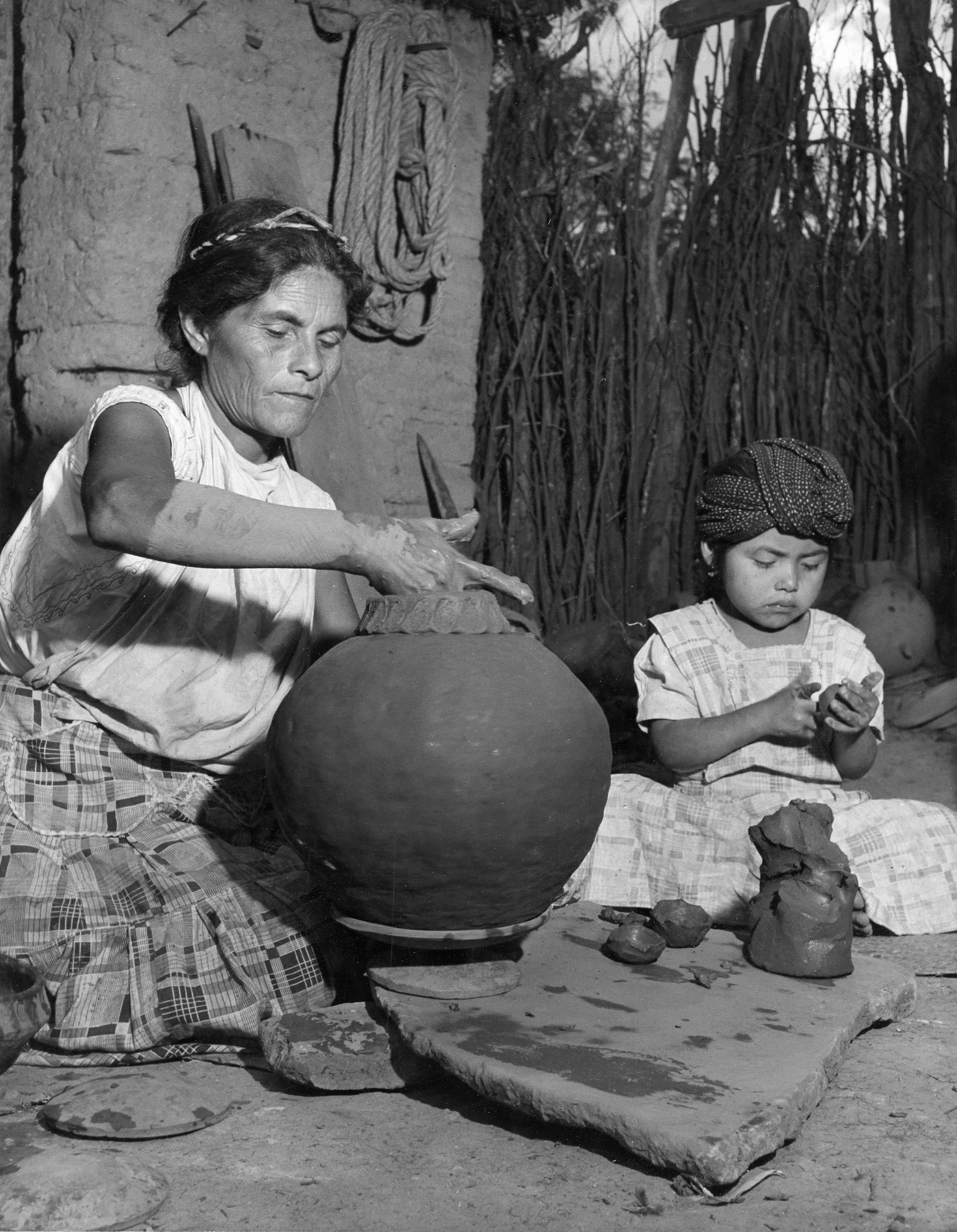 Oaxaca Potters , 1948 Gelatin silver photograph on mount. 13 1/4 x 10 3/8 inches